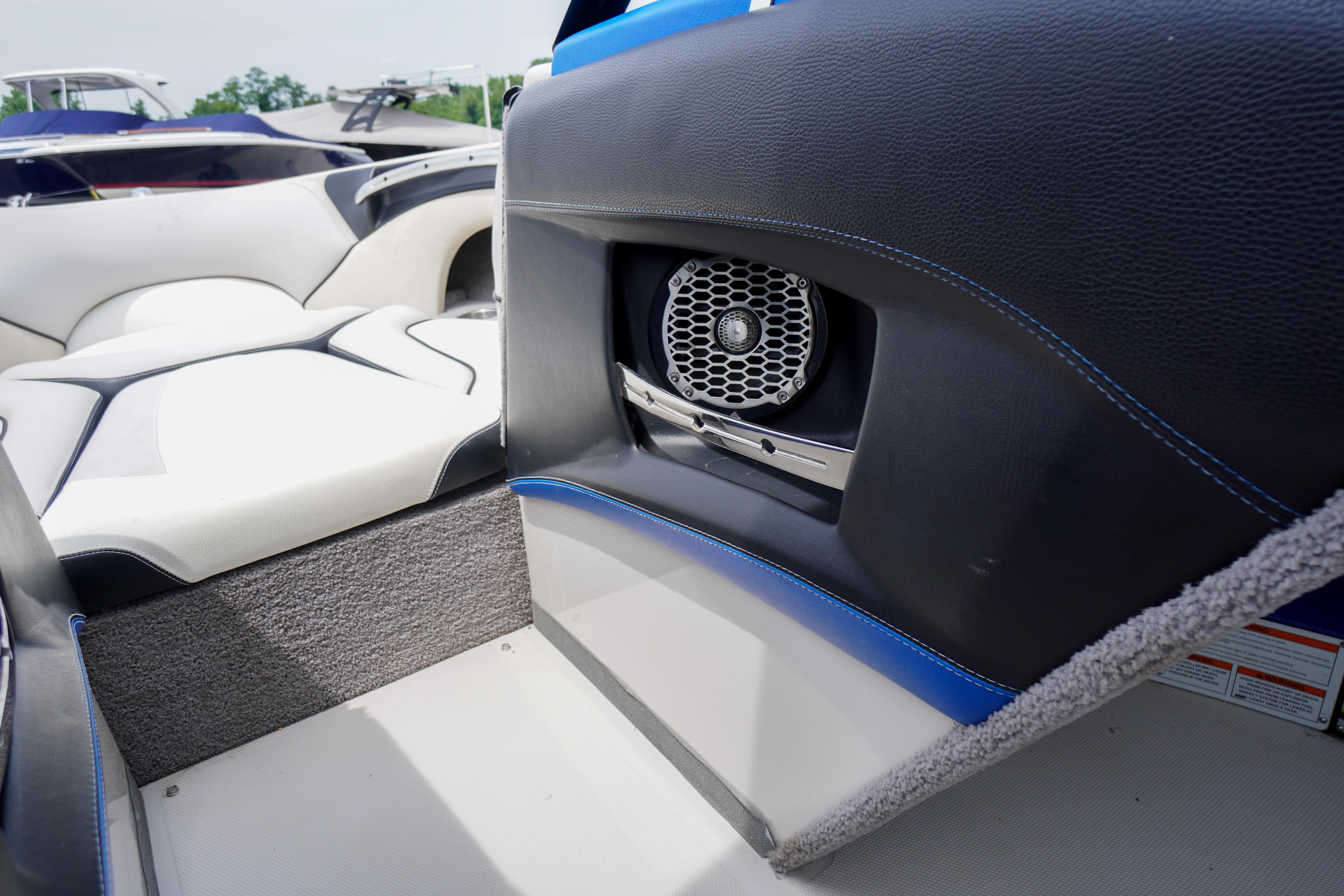 Interior of 2011 Malibu Wakesetter 21 VLX boat with speaker and seating.