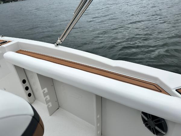 2025 Starcraft SVX 211 OB CC boat interior detail with water view.