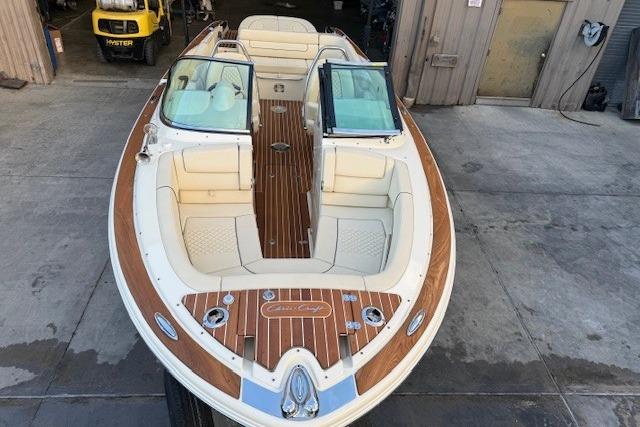 2022 Chris-Craft Launch 25 GT boat with elegant wood detailing and spacious seating.