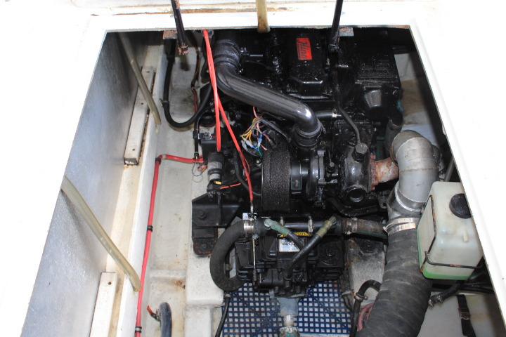 Engine compartment of 1992 Bayliner 3288 Motoryacht, showcasing mechanical components and wiring.