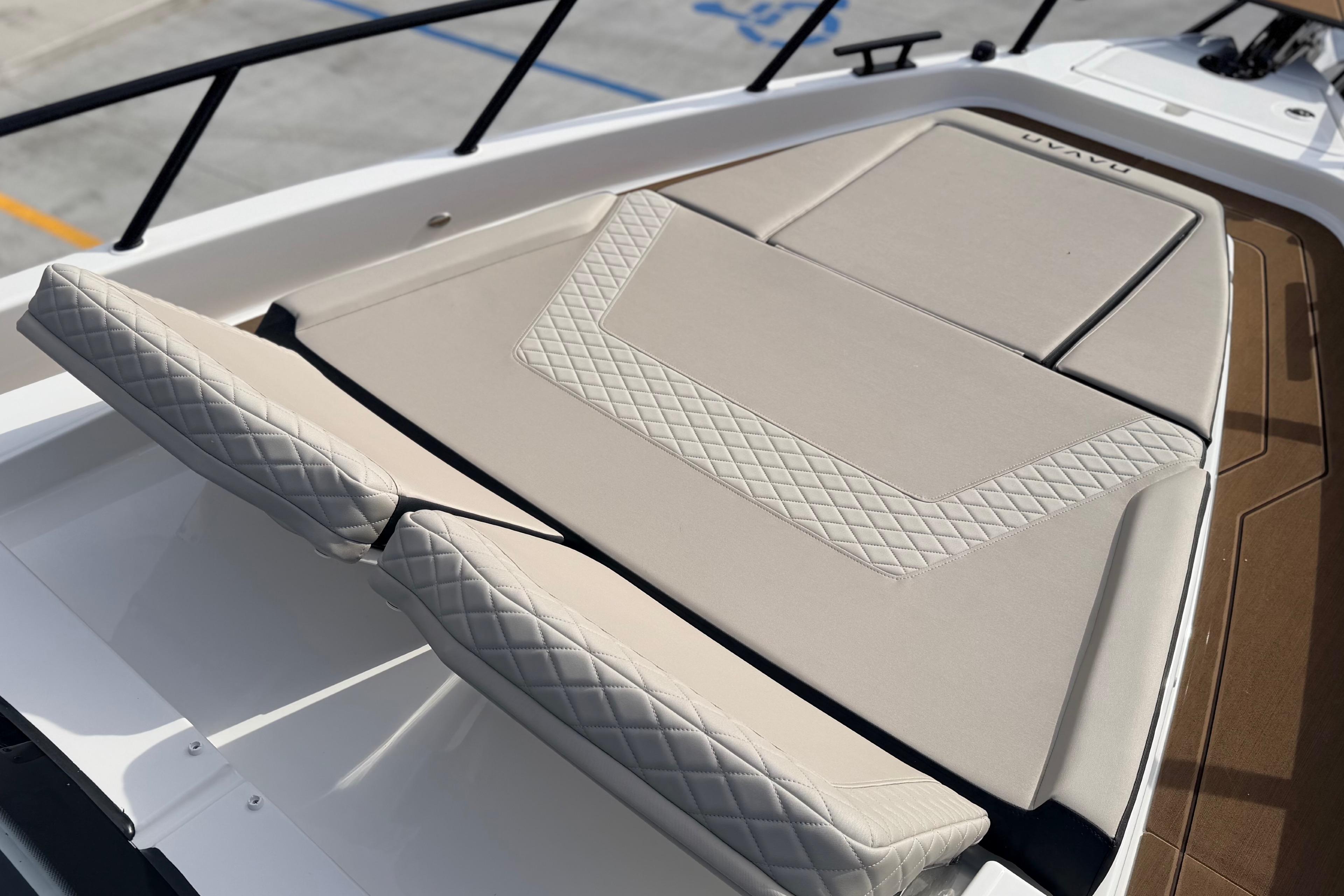 Luxurious seating on 2026 Navan S30 boat with quilted upholstery design.