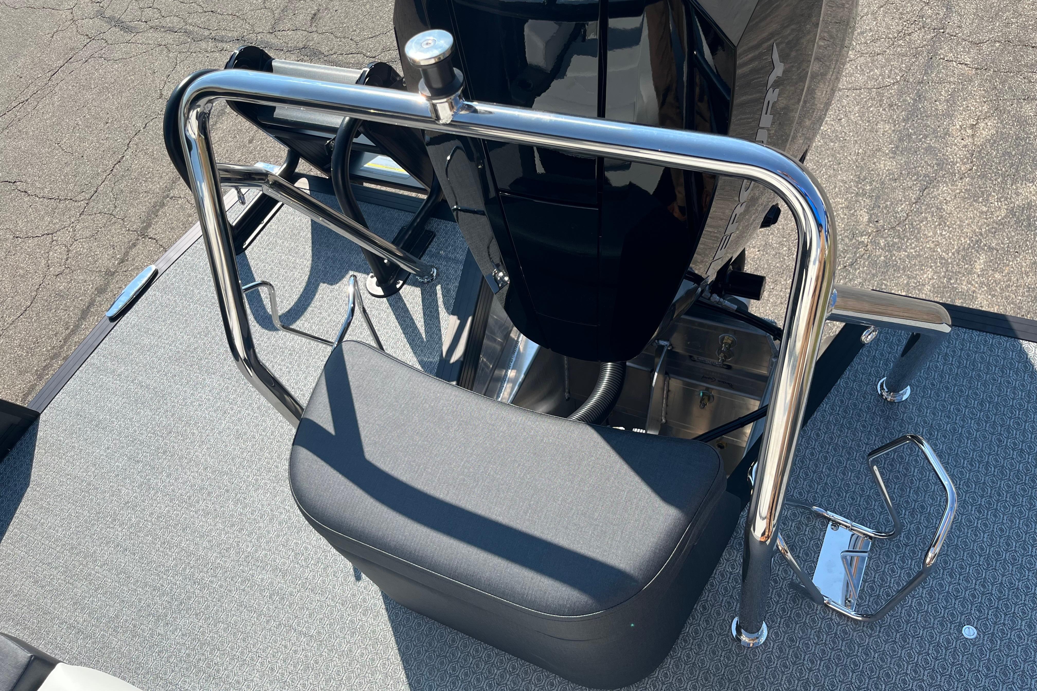 Rear view of 2026 Evotti 725CS boat with stainless steel railing and cushioned seat.