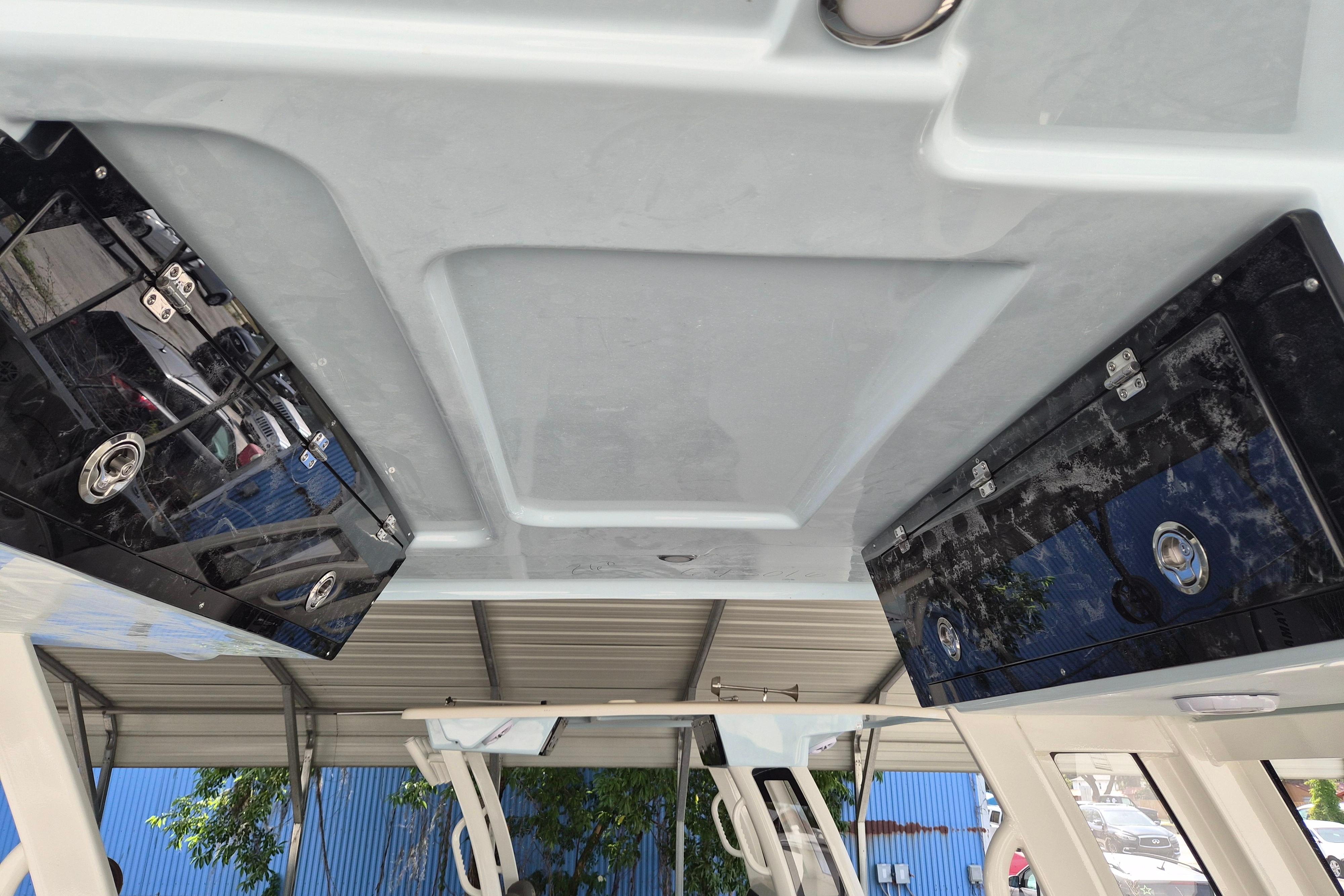 2026 Key West 260 Center Console boat interior with overhead storage compartments.
