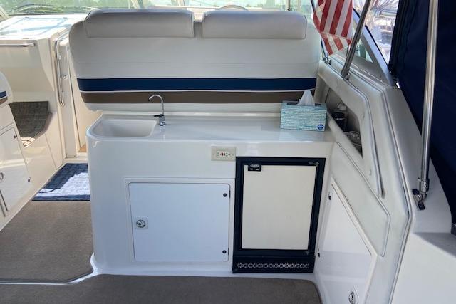 1994 Cruisers Yachts 3675 Esprit interior with kitchenette and seating area.