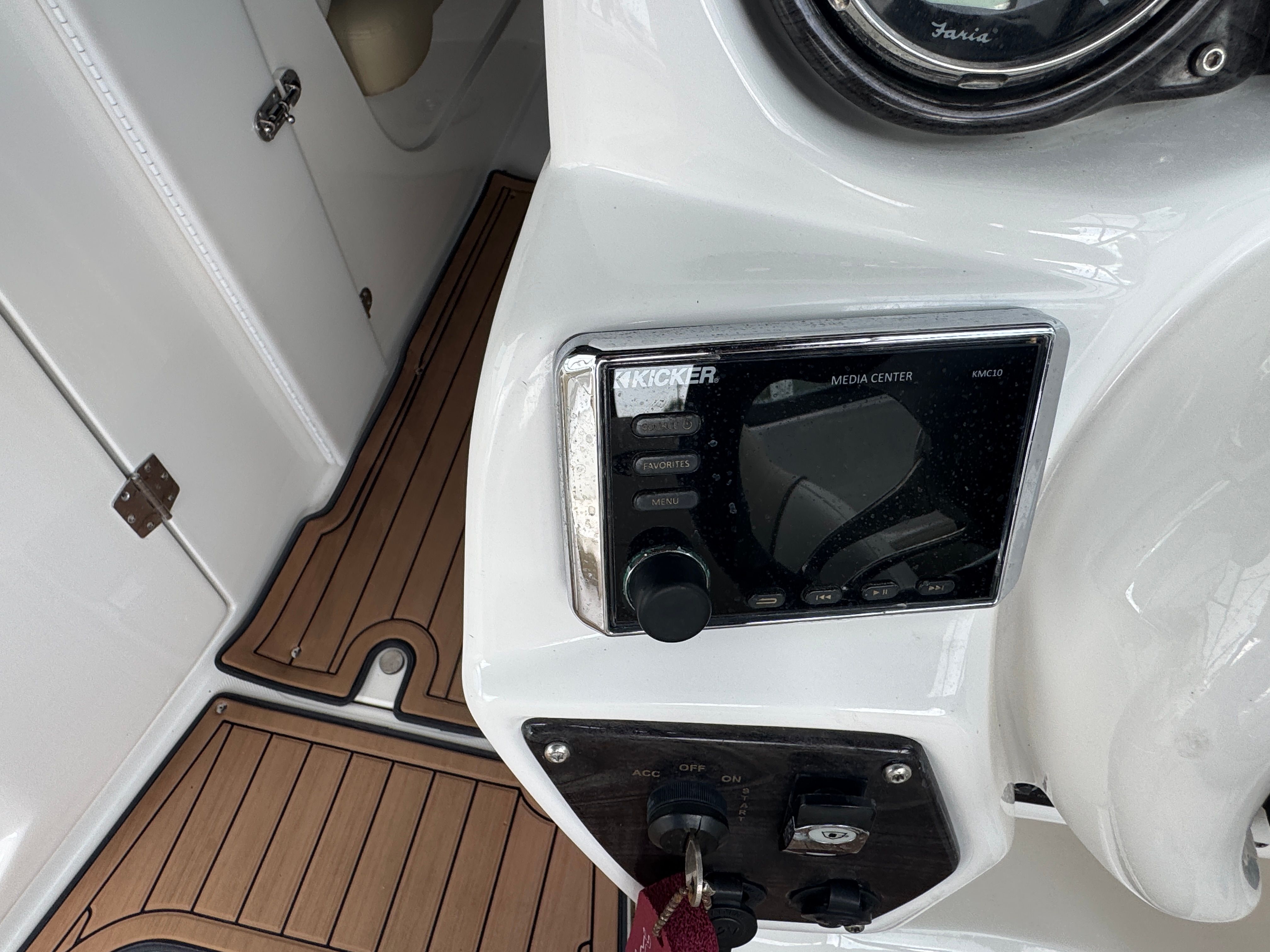 2017 Rinker QX29 BR boat console with Kicker media center.