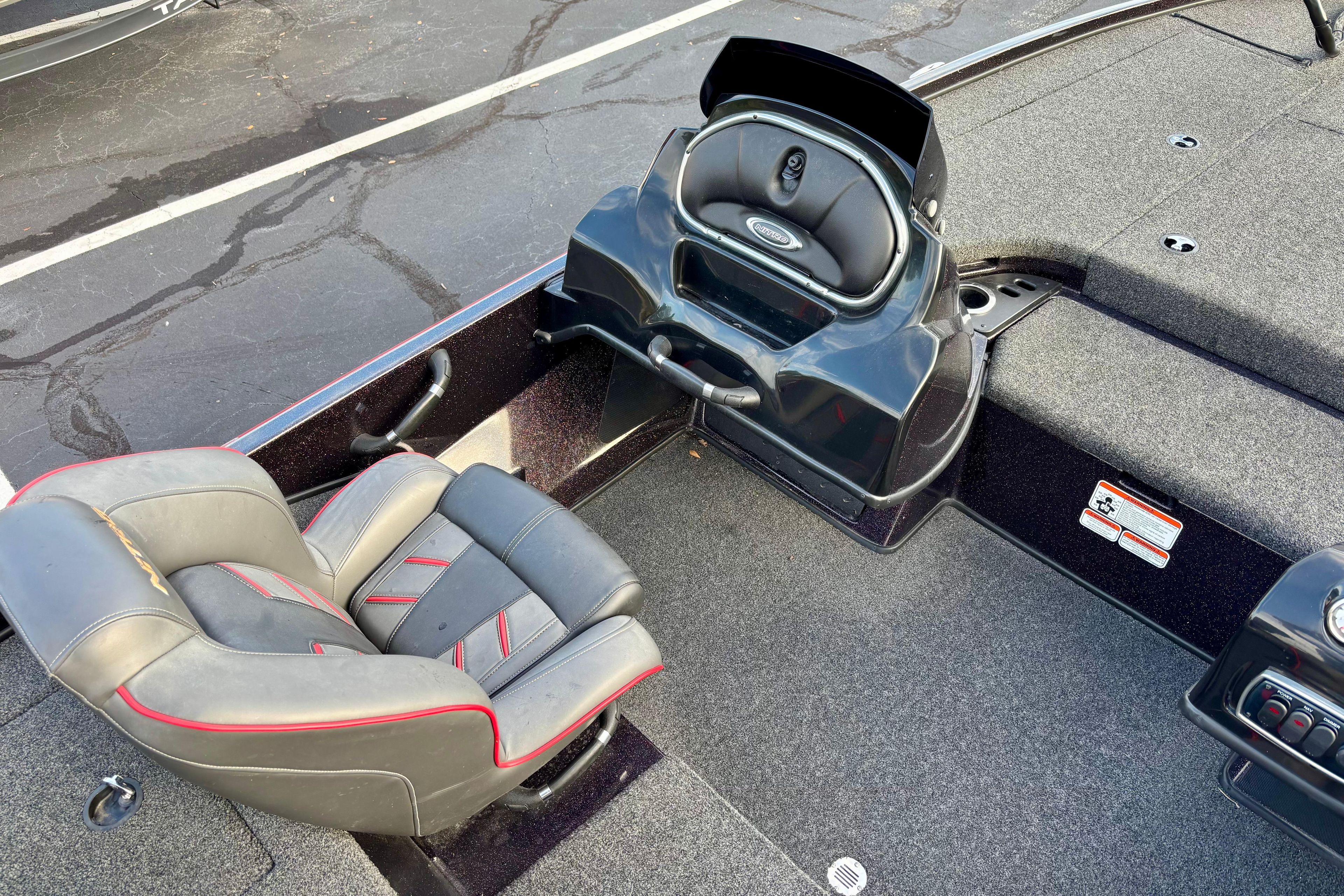 2018 Nitro Z18 boat interior with seating and control panel, featuring sleek design and modern amenities.