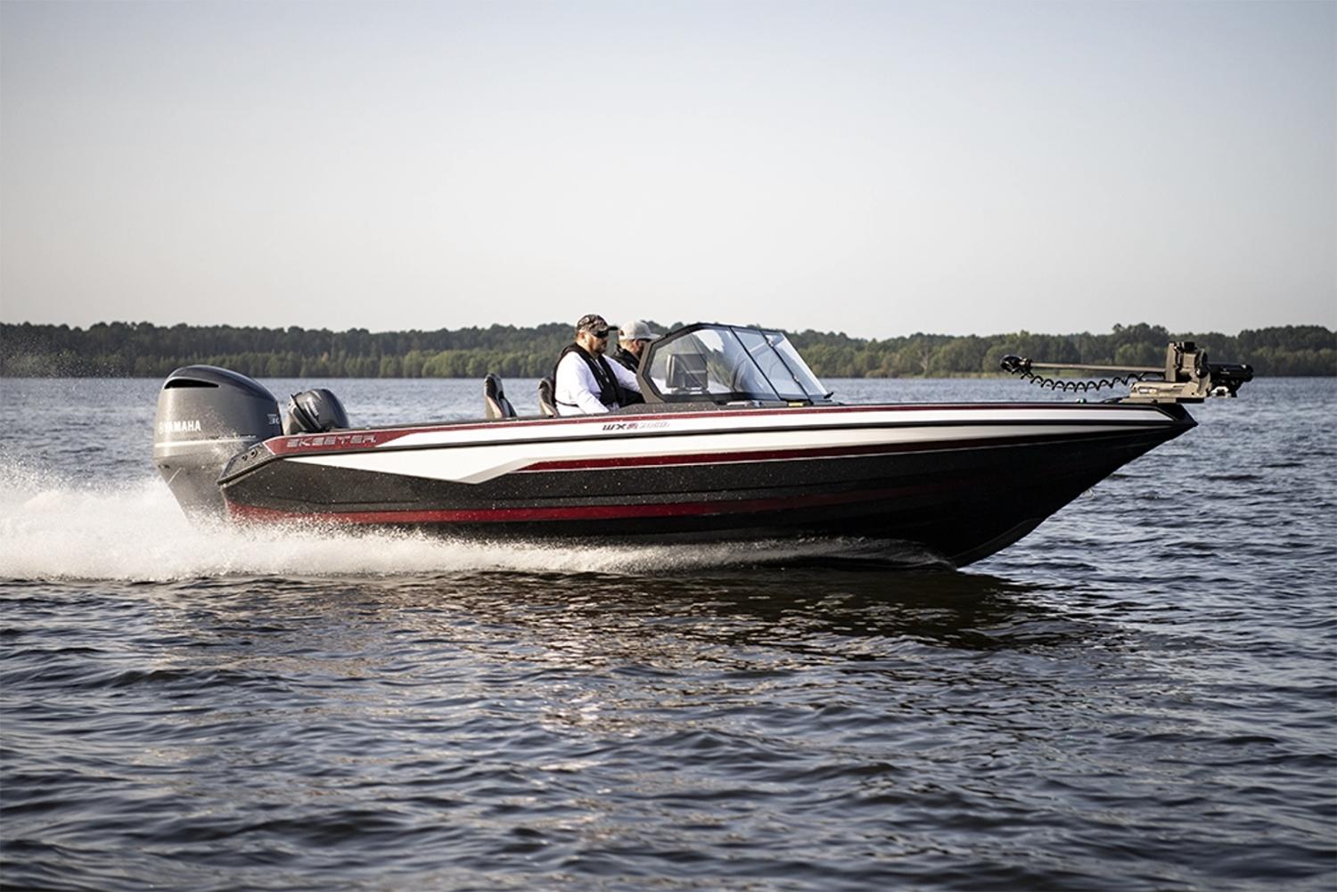 Manufacturer Provided Image: 2026 Skeeter WXR2060 boat cruising on a lake with two passengers.