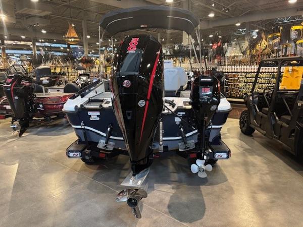 2023 Nitro ZV20 Pro boat displayed indoors with powerful outboard motor.