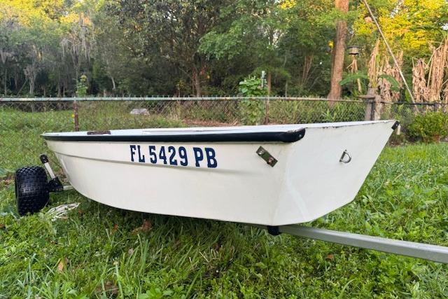 1999 Beacon Boats Pram on grass, displaying registration FL 5429 PB, surrounded by trees.