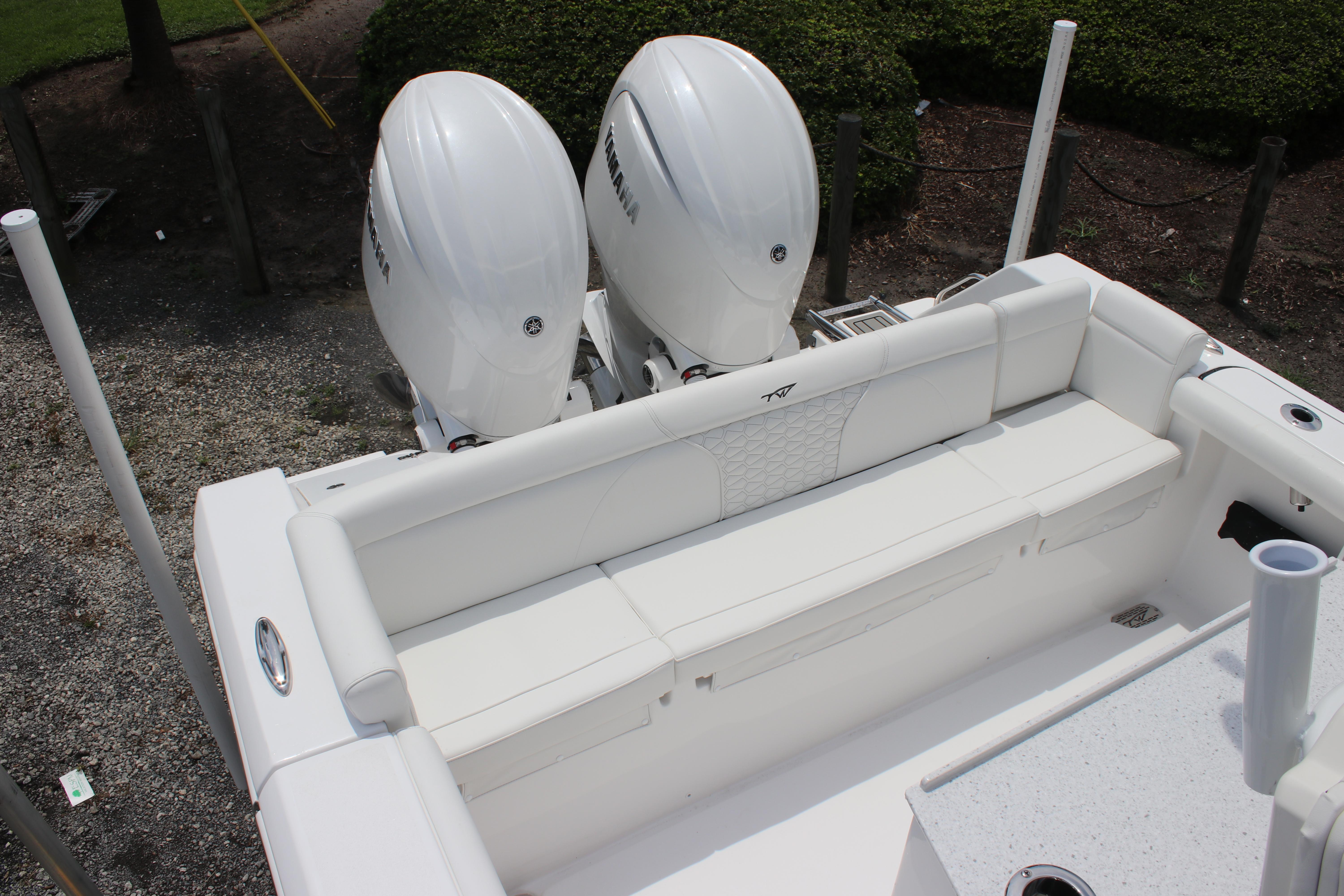2026 Tidewater 272 LXF boat with dual Yamaha engines and white seating.