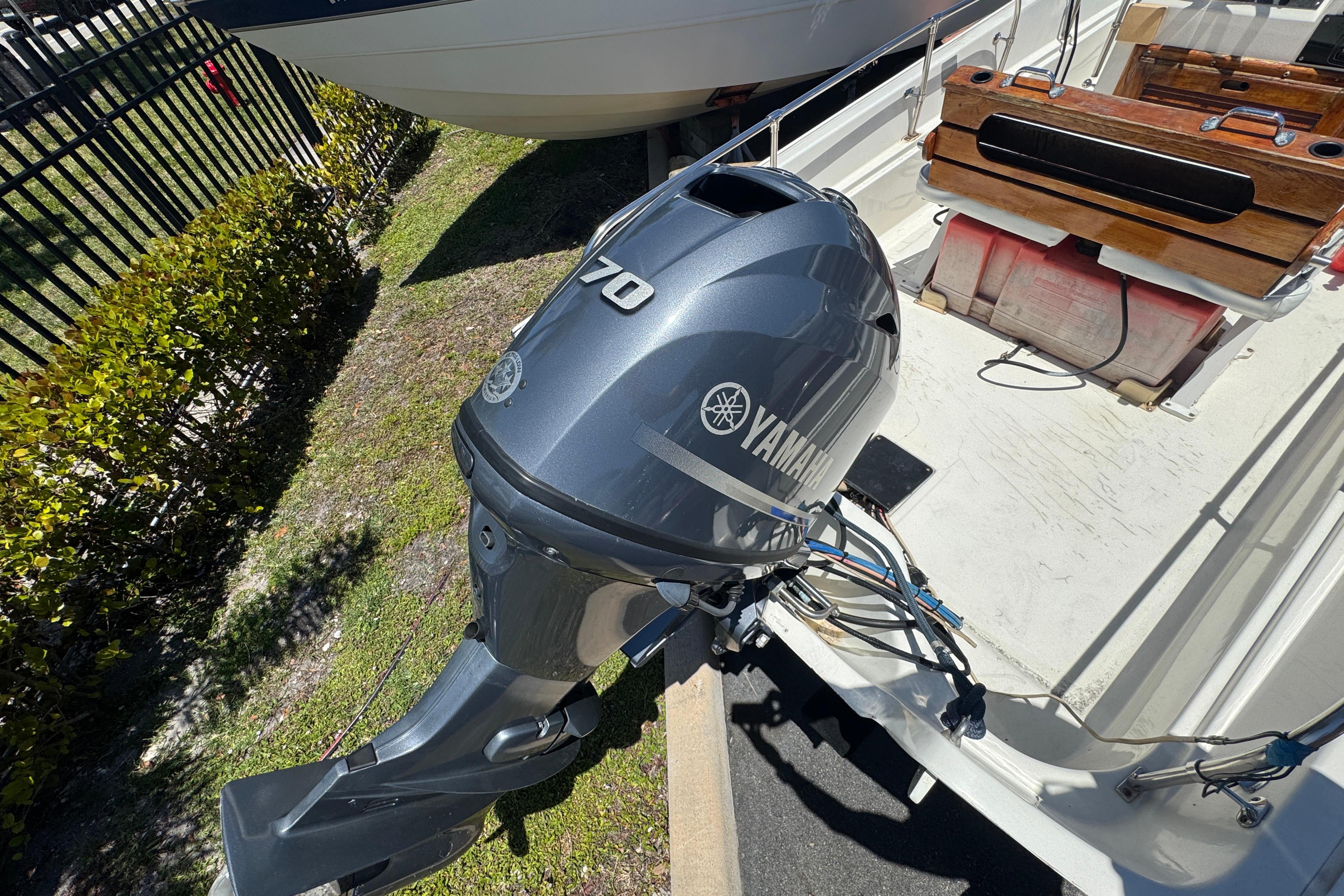 1988 Boston Whaler 170 Montauk with Yamaha outboard motor, docked outdoors.