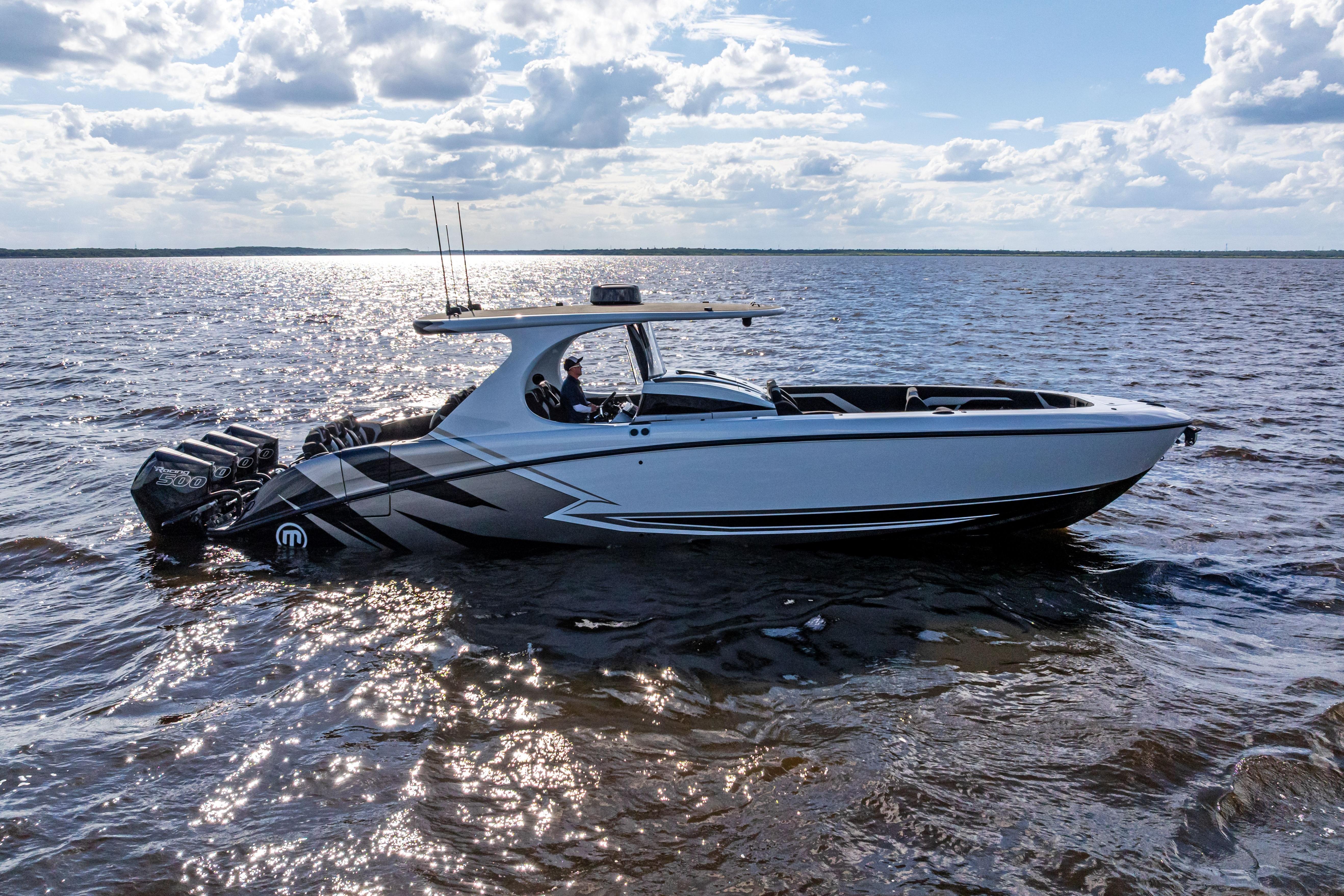 2027 Mystic Powerboats M4200 cruising on a sunny day with powerful engines.