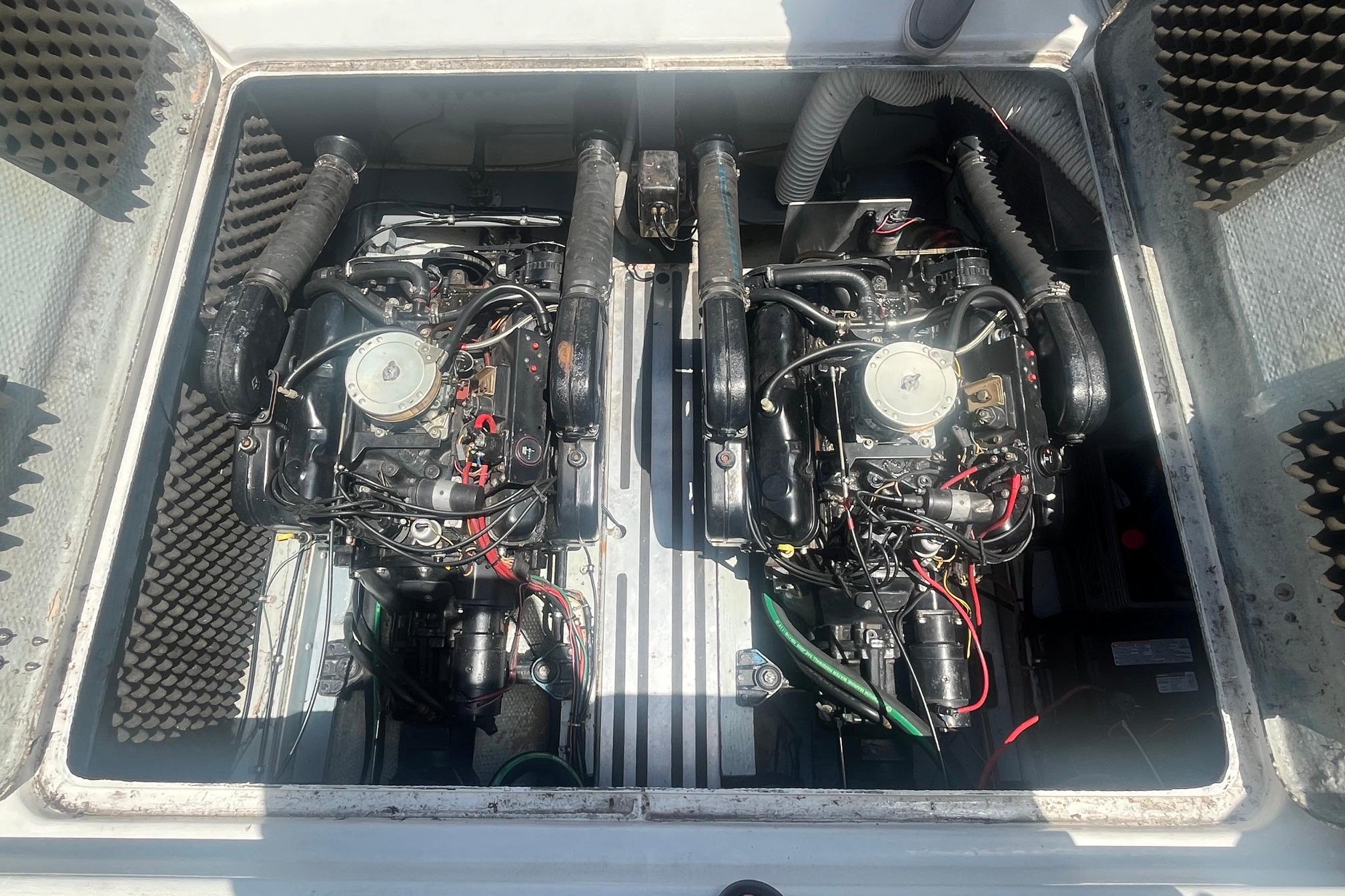 Twin engines in a 1988 Seafox 29 Flybridge boat engine compartment.