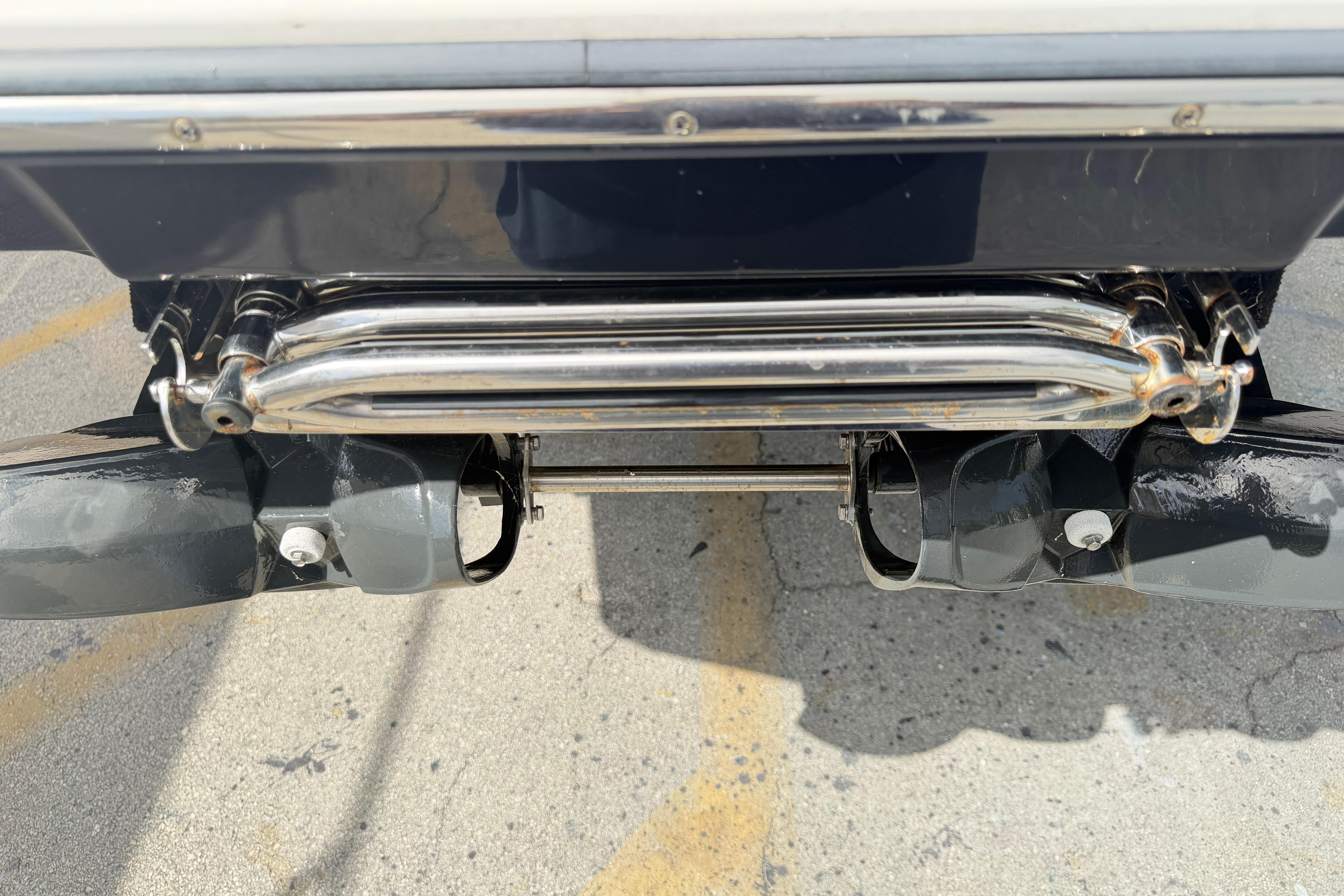 Rear view of 2026 Scarab 235 LX boat's dual exhaust system.