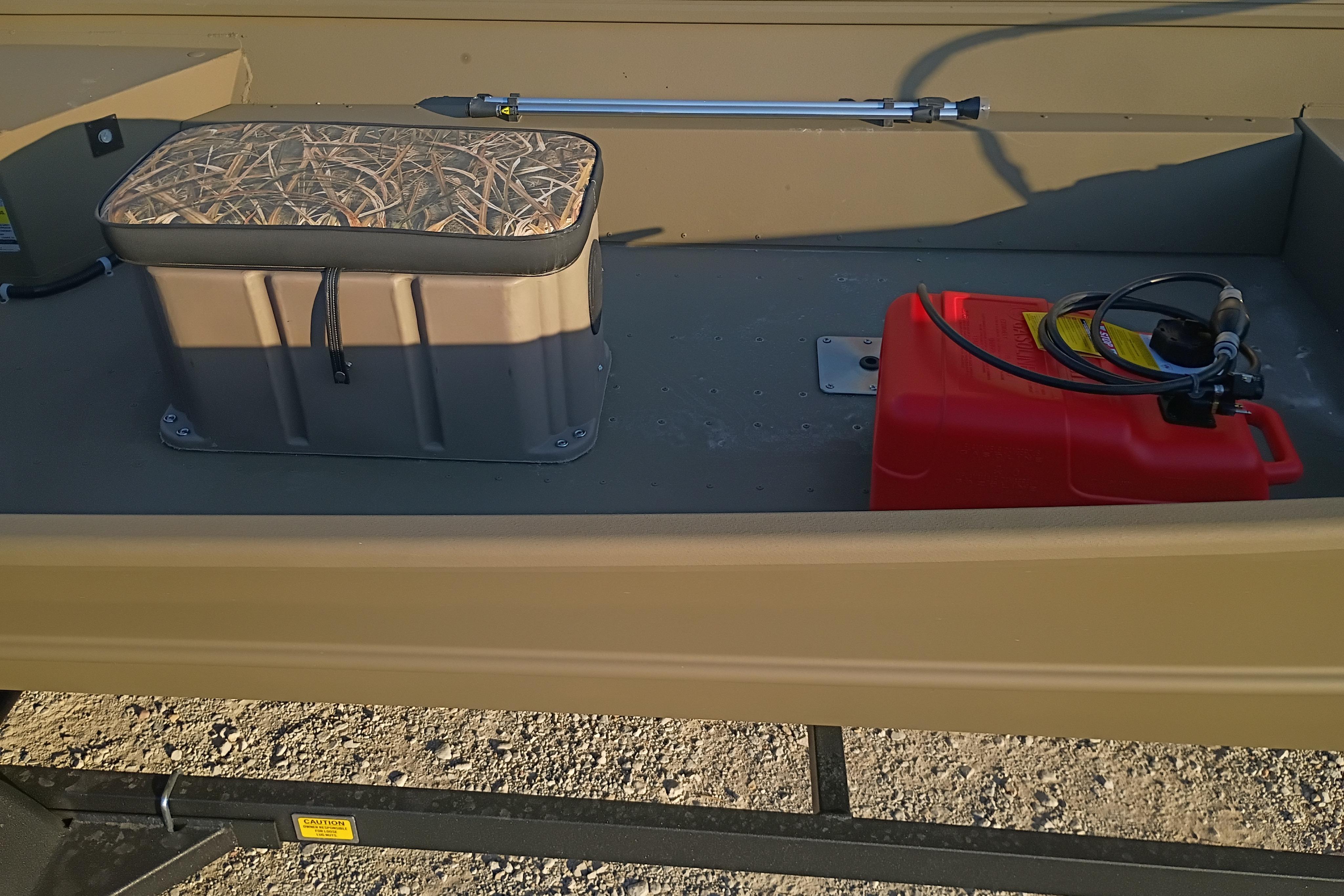 2026 G3 Gator Tough 16 FL boat interior with storage box and red fuel tank.