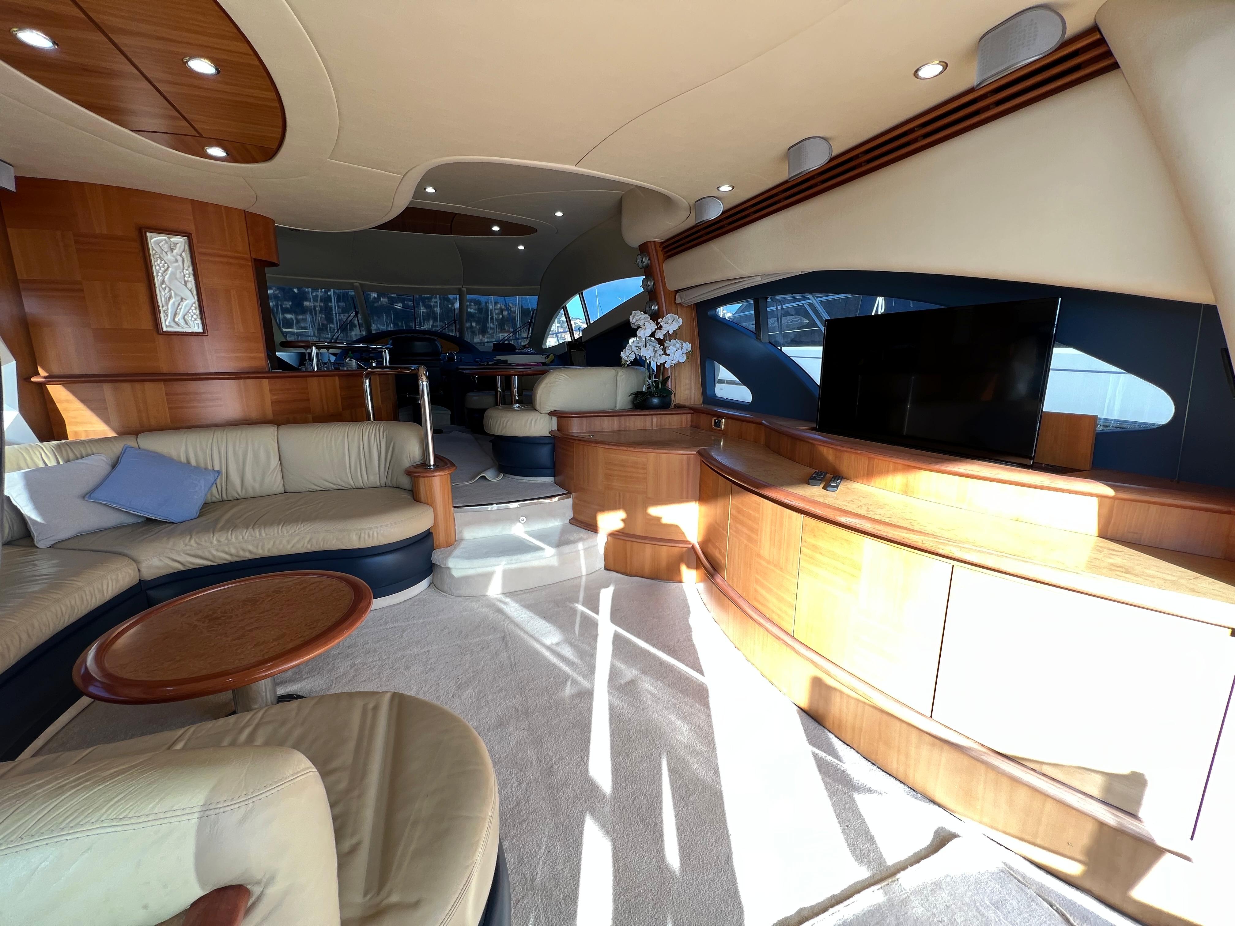 Luxurious interior of a 2005 Azimut 62 yacht with elegant seating and modern amenities.