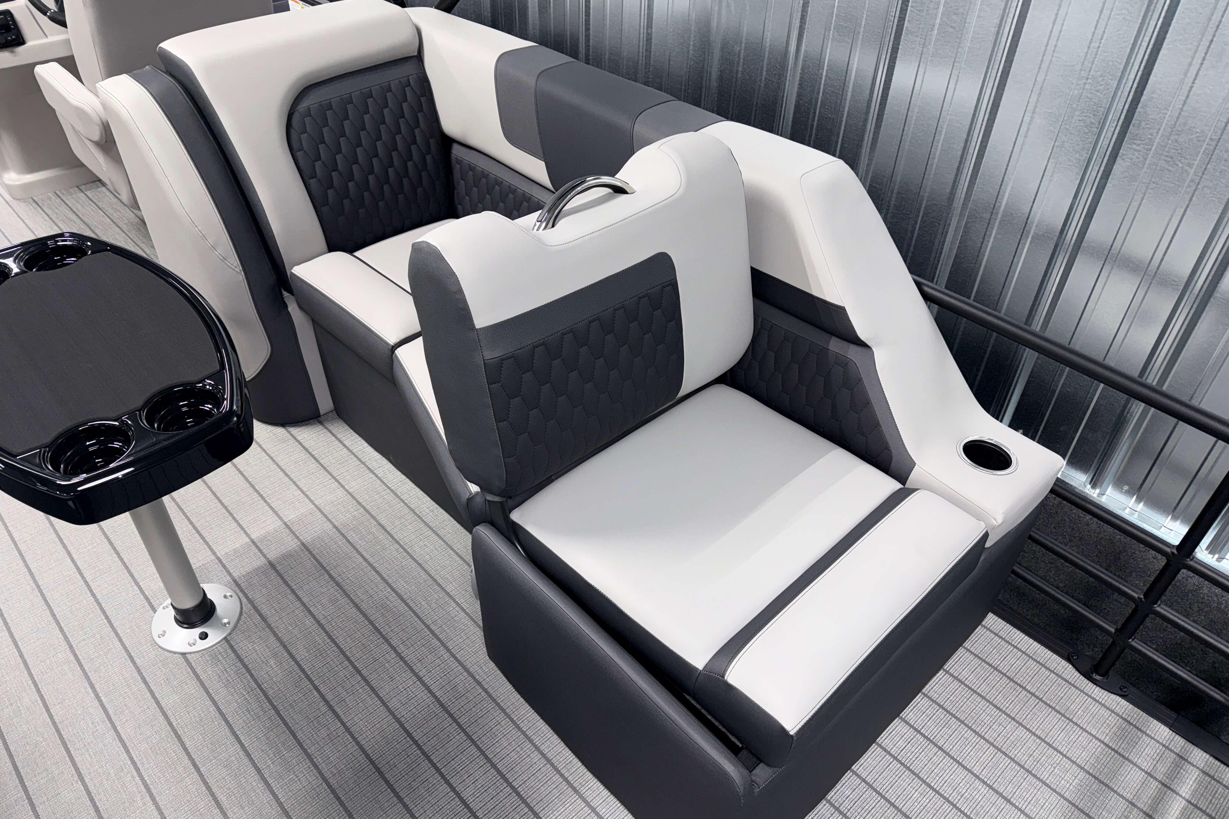 2026 Sylvan L3 SLZ boat interior with stylish seating and cup holders.