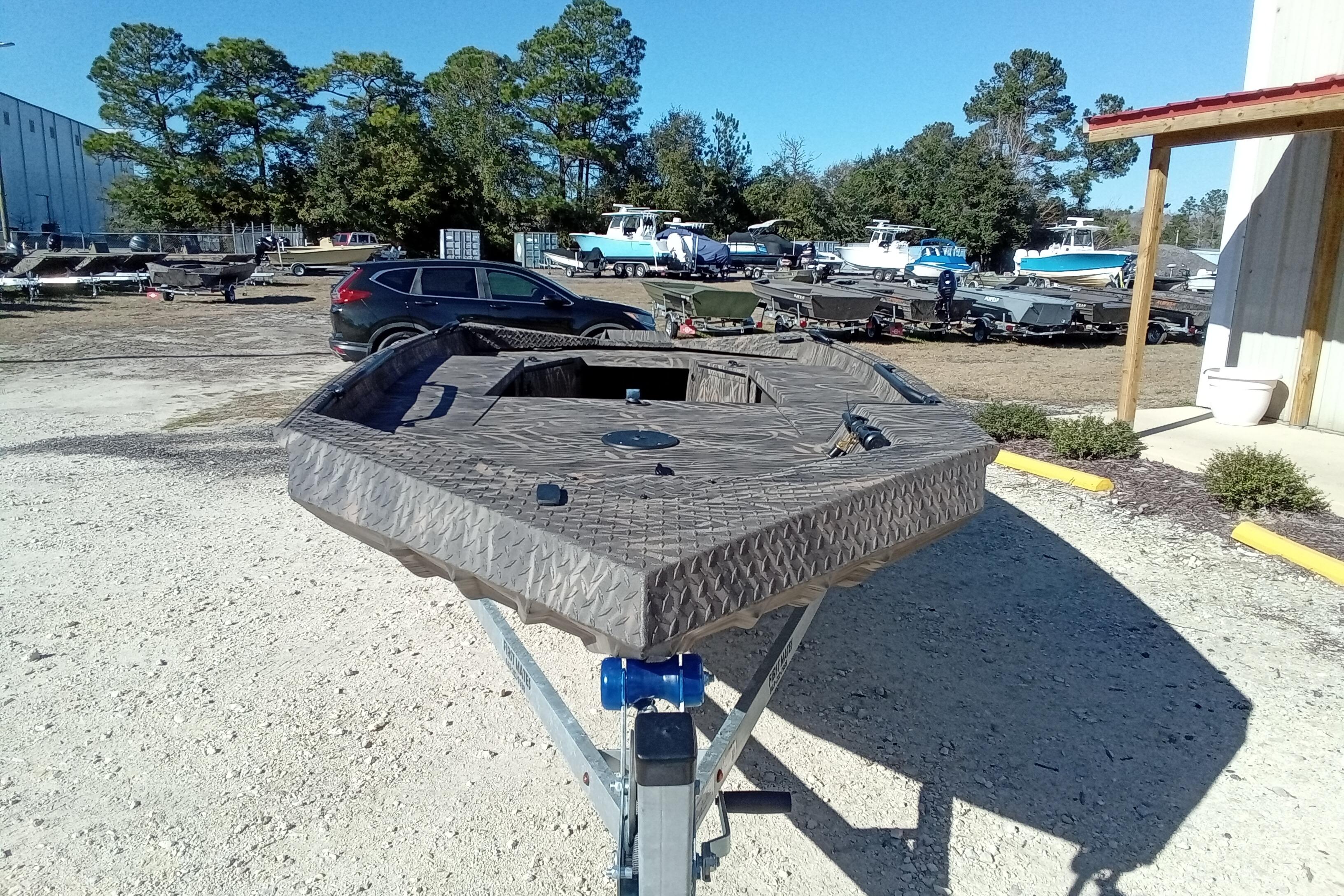 2026 Alweld 1652 Invader boat on trailer in outdoor lot.