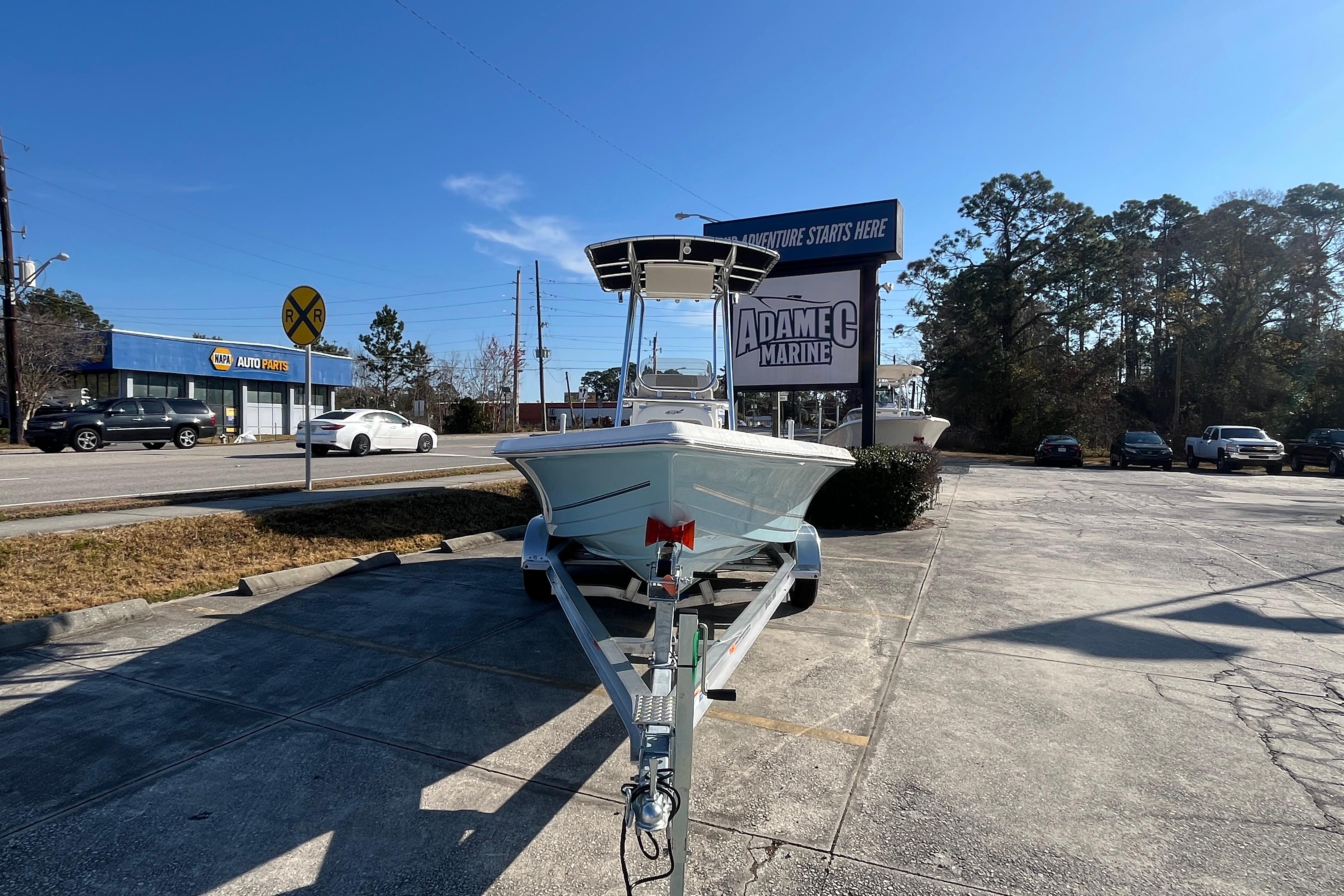 2026 Bulls Bay 2200 boat on trailer at Adamec Marine dealership.