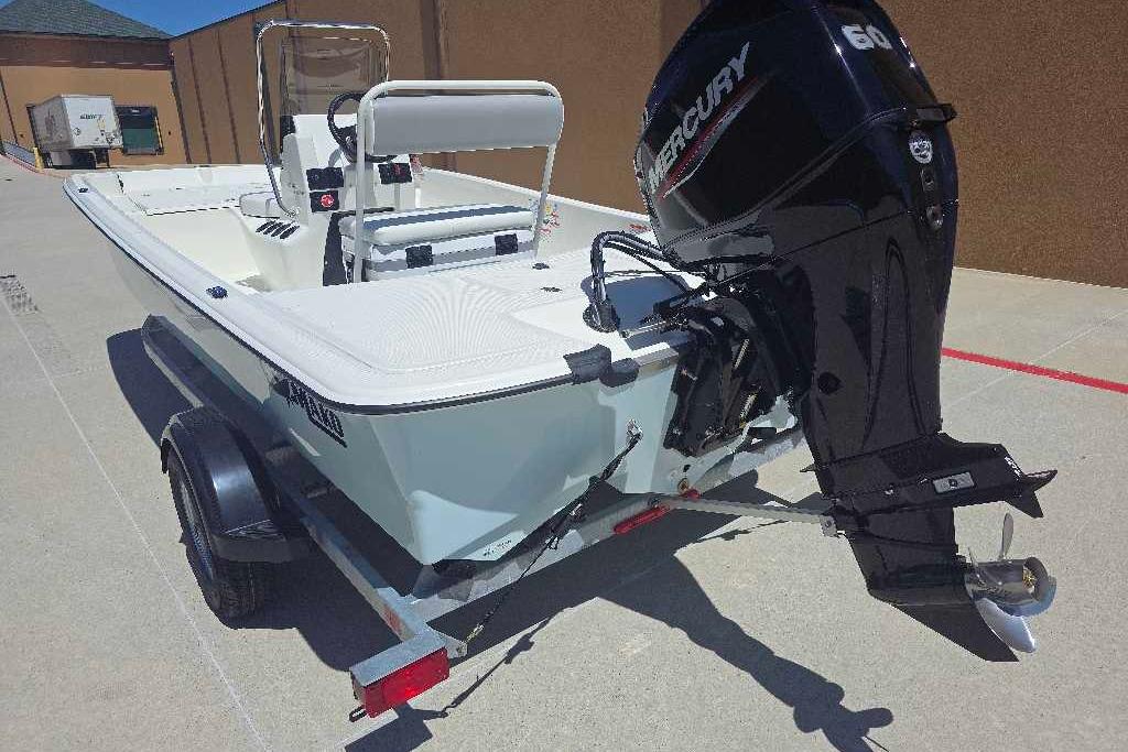 2026 Mako Pro Skiff 17 CC boat with Mercury engine on trailer.