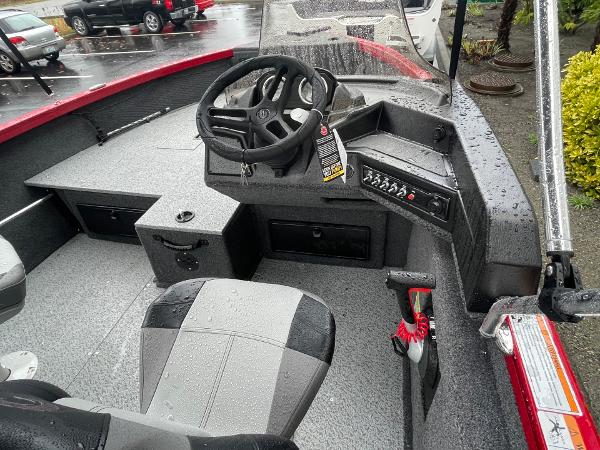 2021 Crestliner 1650 Fish Hawk SC boat interior with steering wheel and control panel.