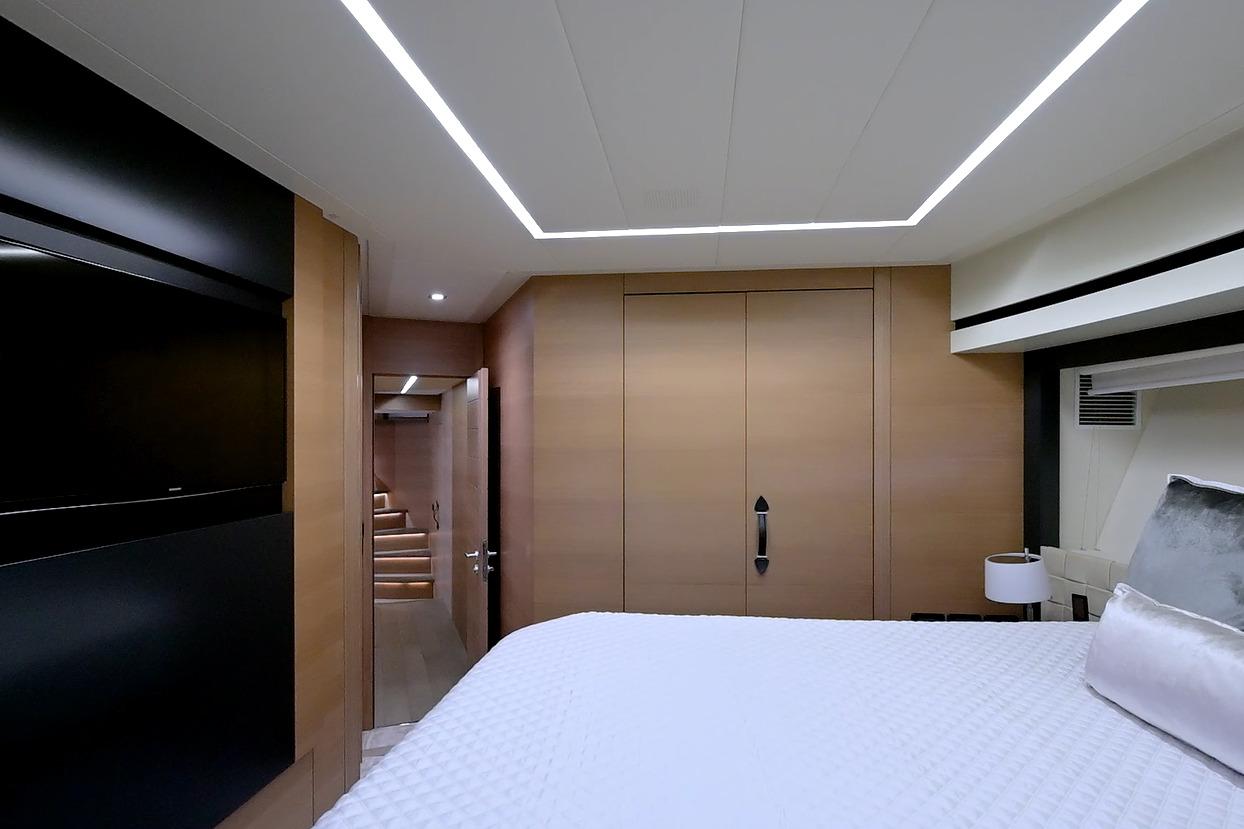 Luxurious interior of 2015 Pershing 92 yacht with modern design and elegant lighting.