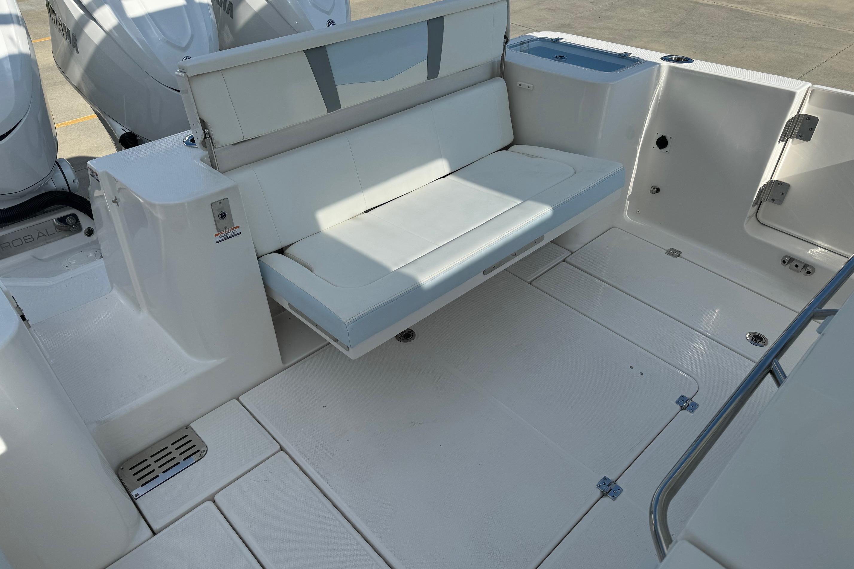 2025 Robalo R360 Center Console boat with foldable seating and spacious deck area.