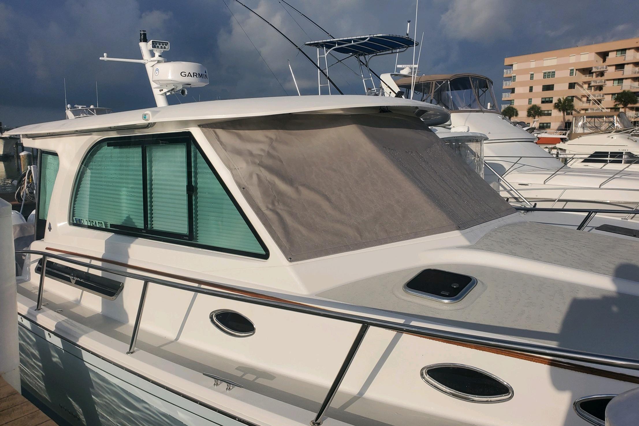2021 Back Cove 390 yacht docked, featuring Garmin radar and sleek design.