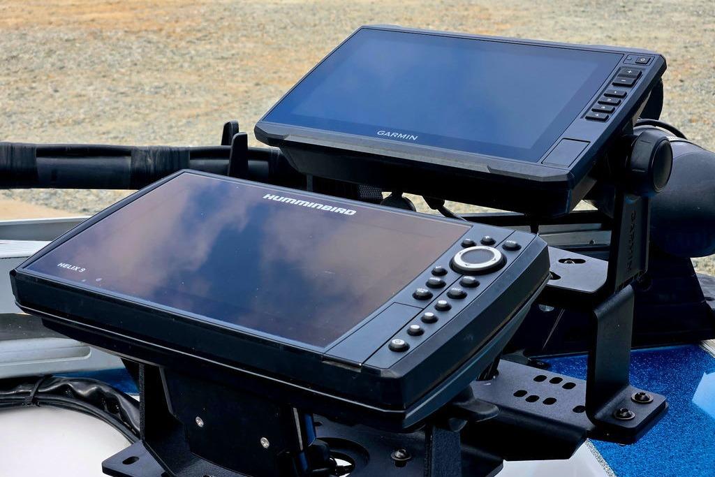 Dual fish finders on a 1996 Champion 181 SX boat, featuring Garmin and Humminbird displays.