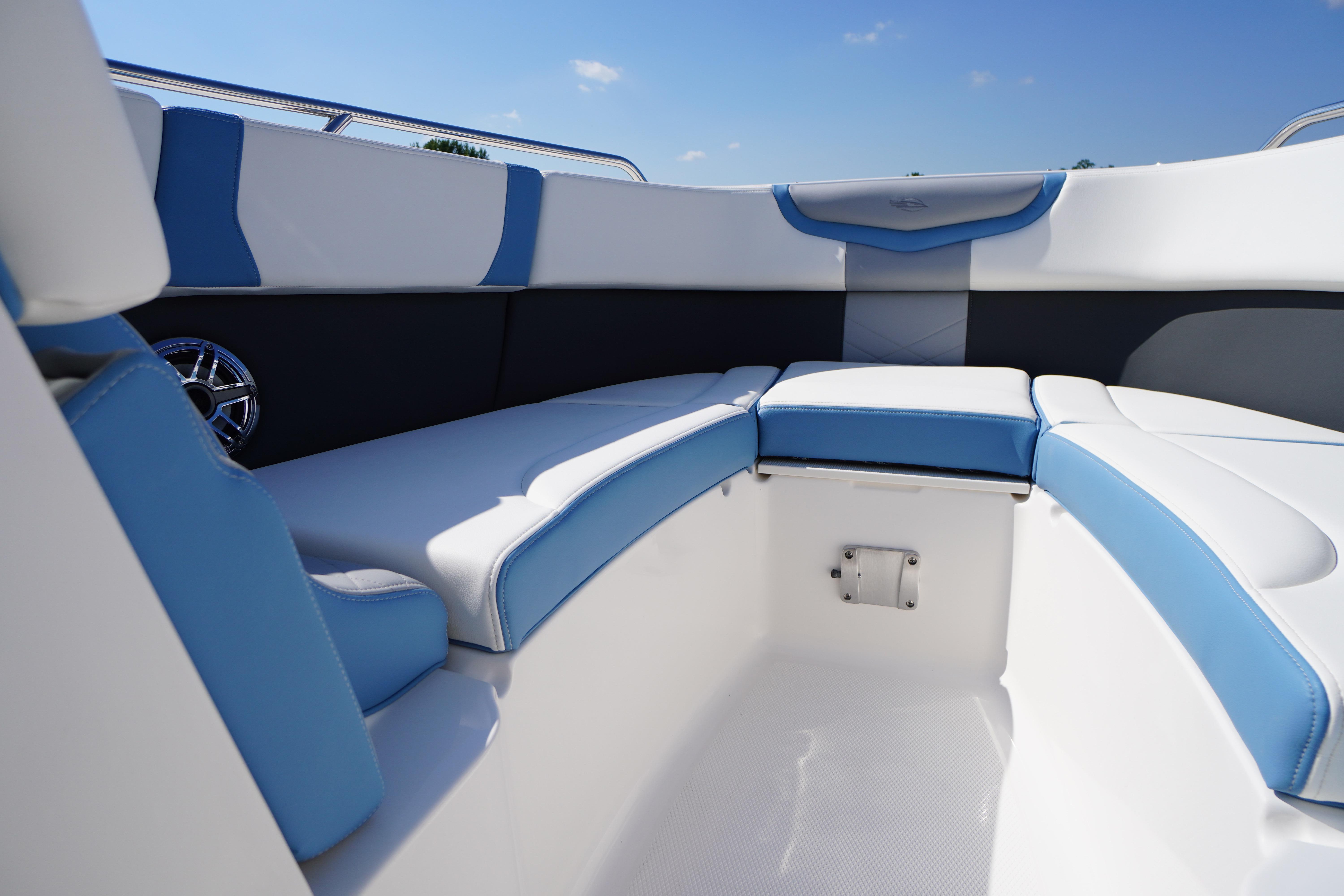 2026 Chaparral 270 OSX boat interior with blue and white seating, showcasing modern design.