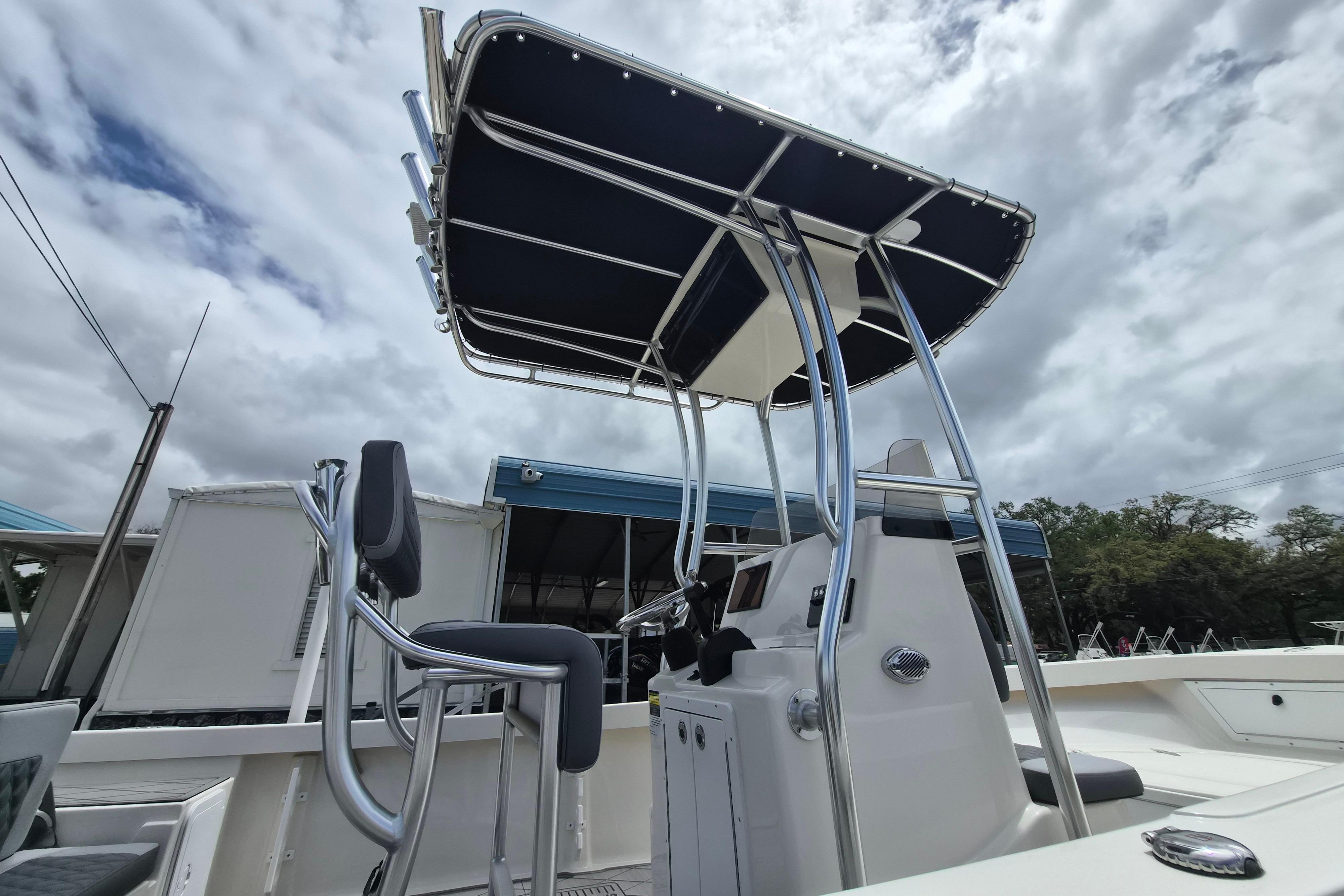 2026 Defiance Catalina 190 boat with T-top under cloudy sky.