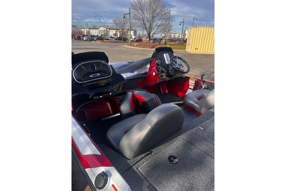 2026 Nitro Z17 boat interior with dual consoles and gray seating in a parking lot.