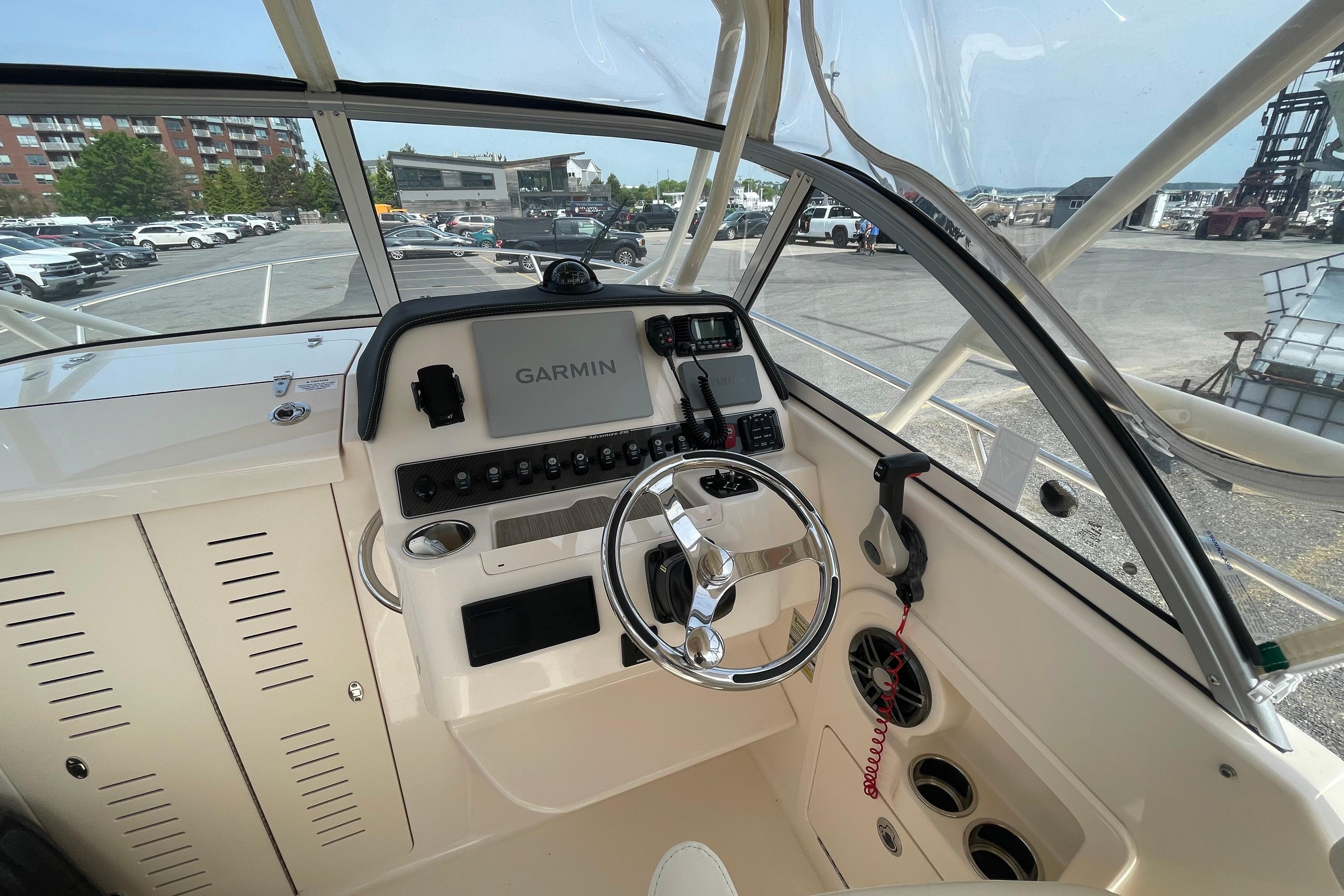 2024 Grady-White Adventure 218 boat cockpit with Garmin navigation system and steering wheel.
