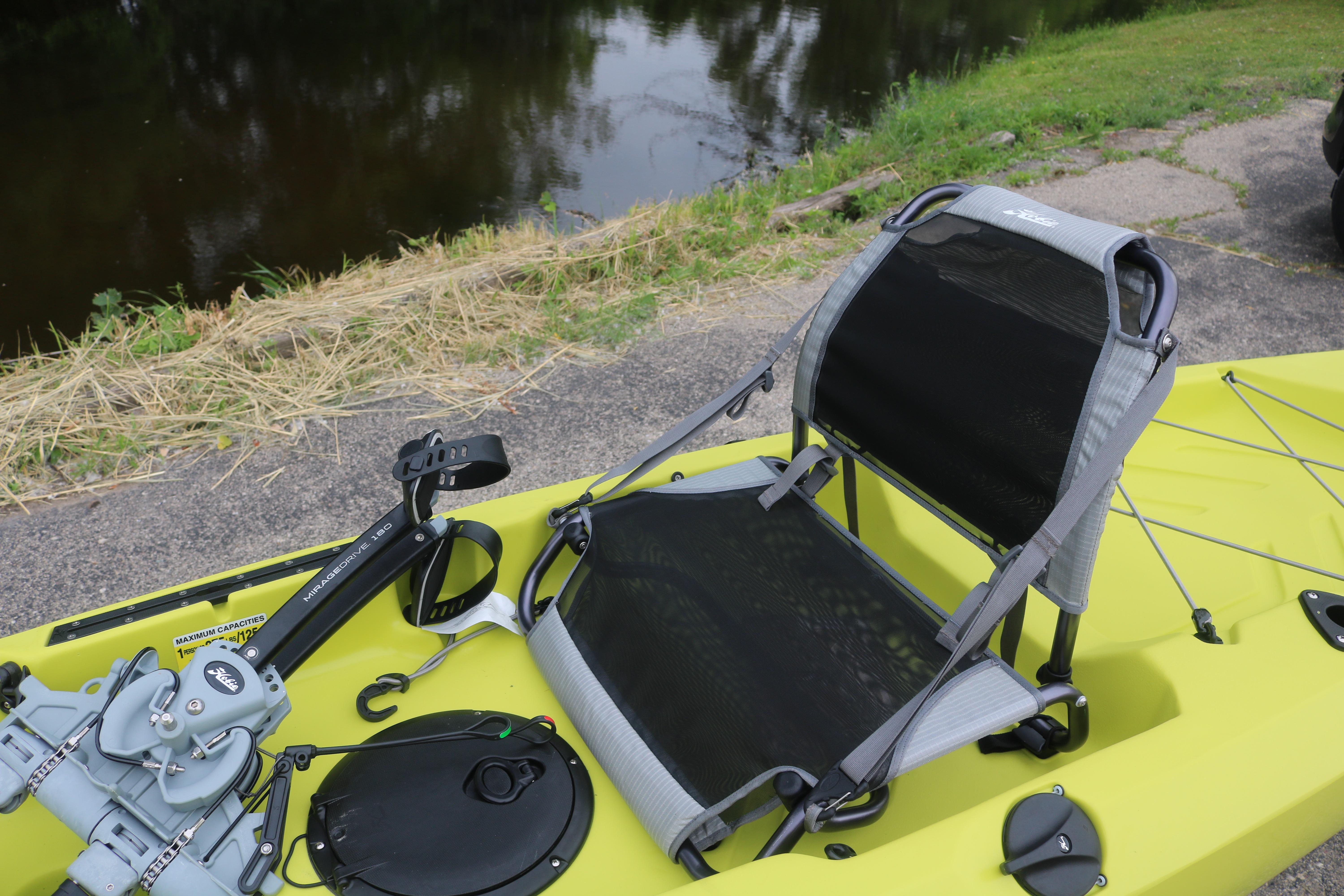 2025 Hobie Mirage Compass kayak with adjustable seat by a riverside.