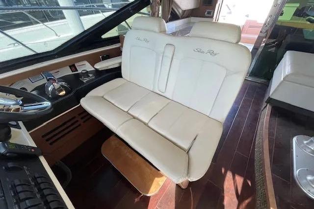 2016 Sea Ray Sundancer 510 interior with plush seating and sleek dashboard design.