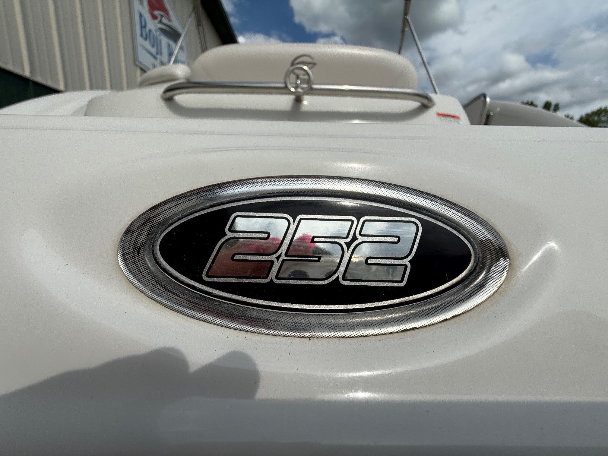 Close-up of the 252 EX emblem on a Crownline boat.