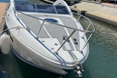 2024 Bracewell 25 boat docked in marina, sleek design, white exterior.