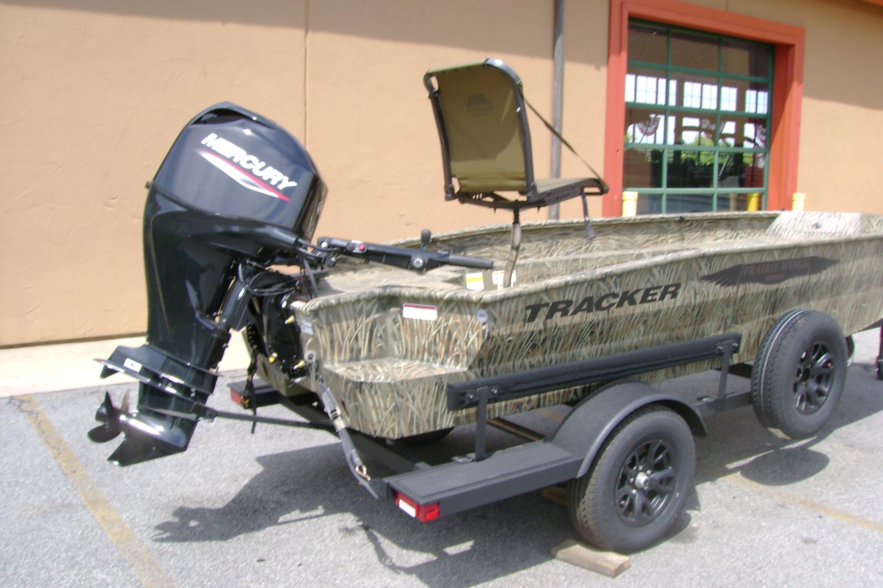 2026 Tracker Grizzly 1650 T Prairie Wings Edition boat on trailer, featuring Mercury outboard motor.