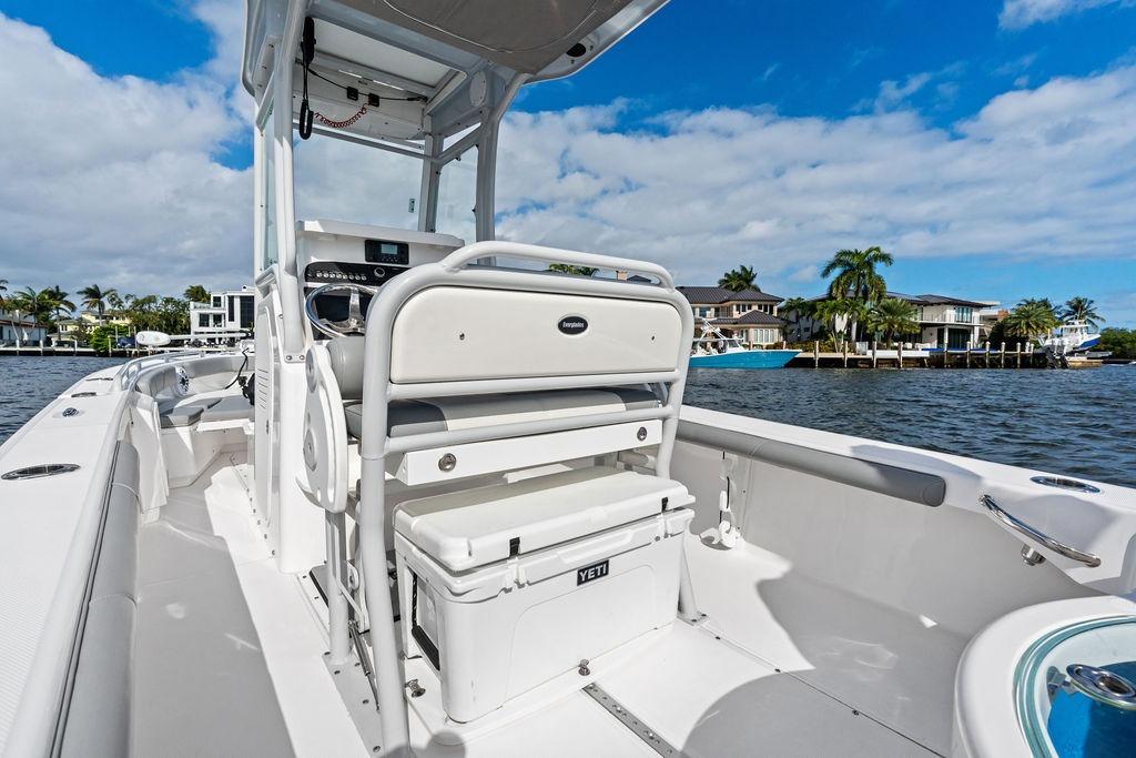 2023 Everglades 243 Center Console boat on water, featuring sleek design and modern amenities.