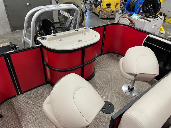 2025 Bentley Pontoons 200 Fish-N-Cruise interior with red panels and beige seating.
