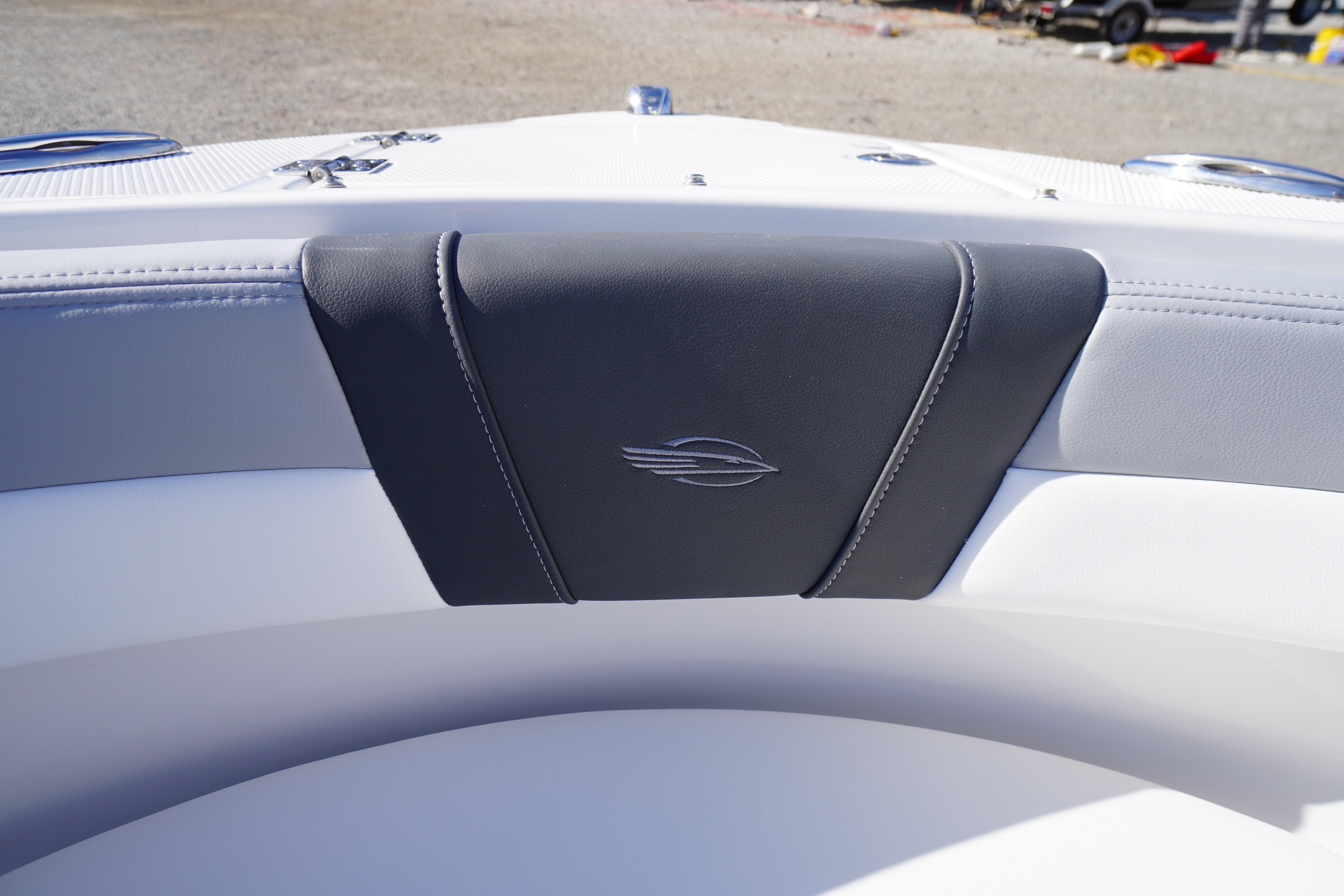 2026 Chaparral 23 SSi OB boat interior with sleek seating and logo detail.