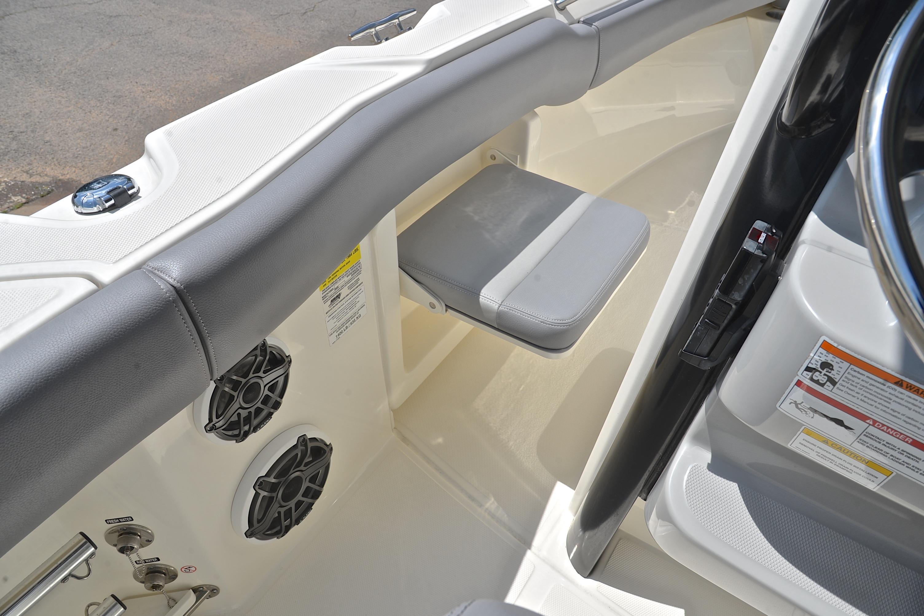 2024 Boston Whaler 250 Outrage interior with seating and audio system.