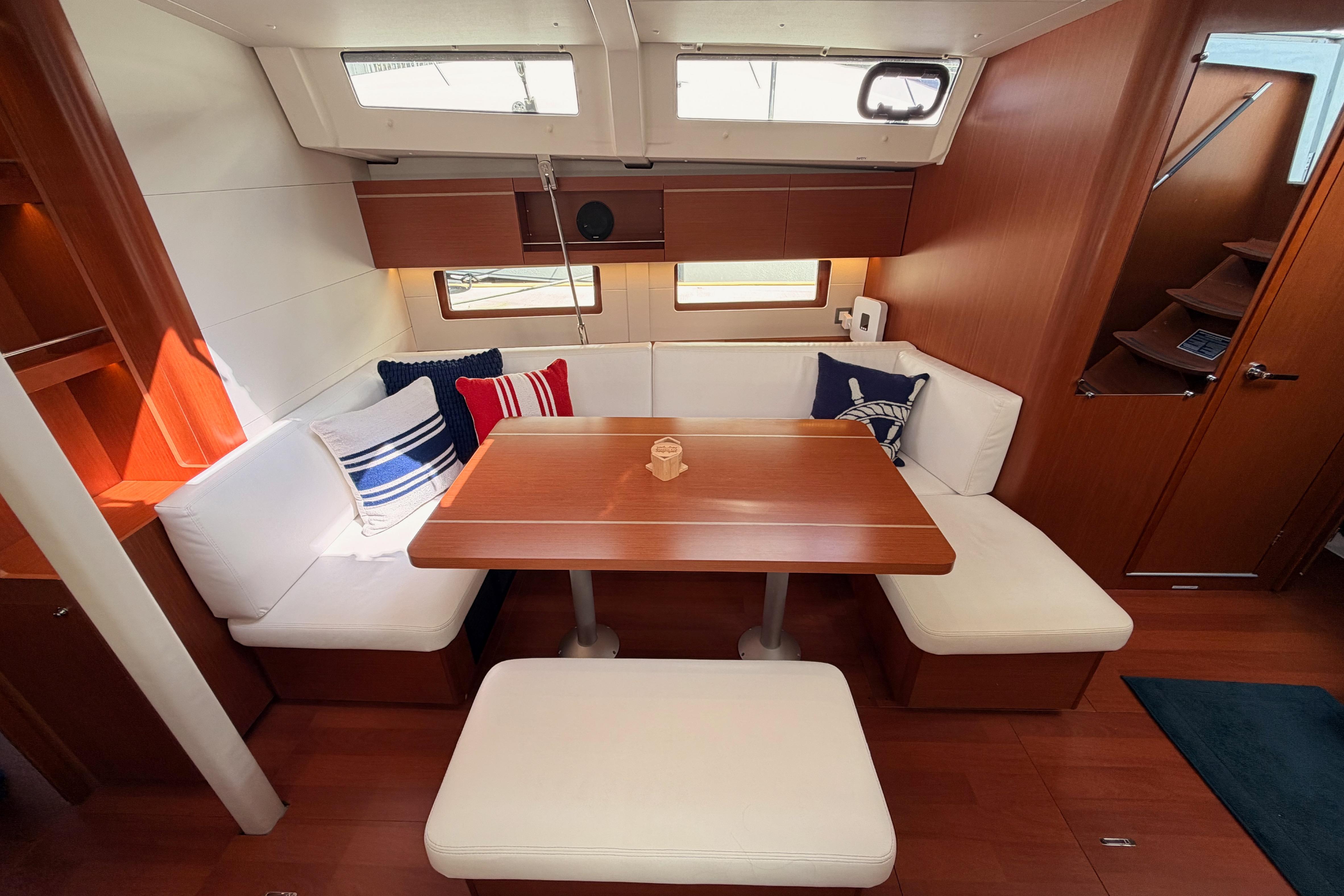Interior of 2020 Beneteau Oceanis 46.1 yacht with cozy seating and nautical decor.