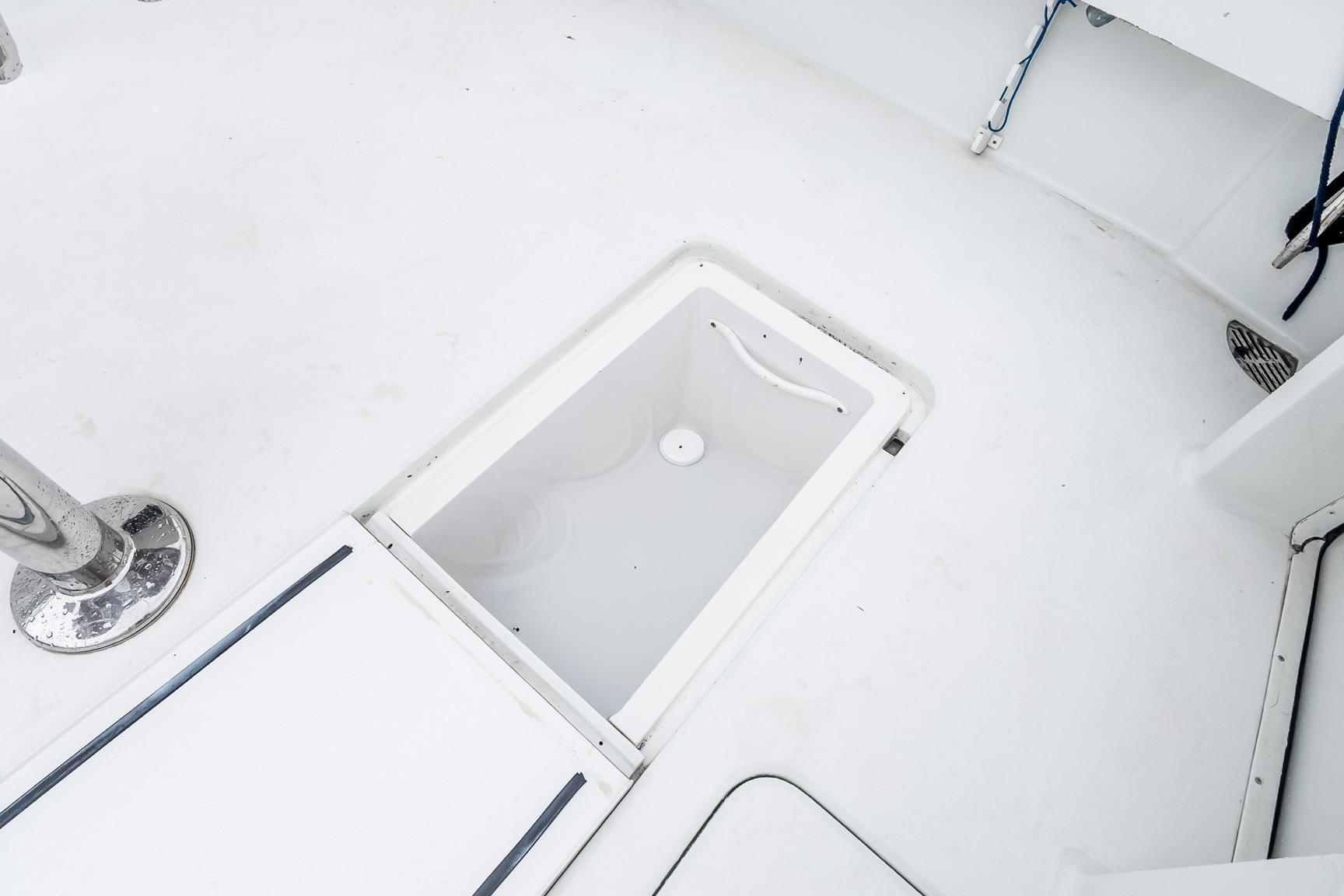 Deck hatch on a 2000 Viking 50' Convertible yacht, showcasing storage space.
