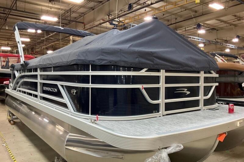 2026 Bennington 22 SSRSF pontoon boat covered in a warehouse setting.