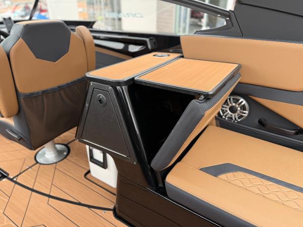 2025 Yamaha Boats 255XD interior with tan seating and modern design features.