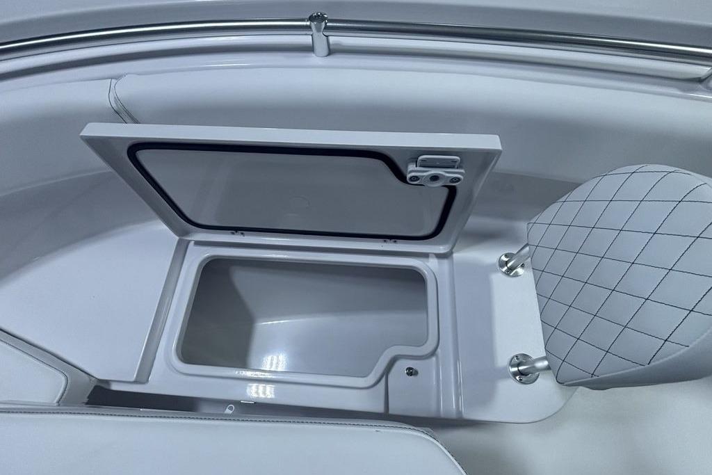 Open storage compartment on 2026 Sportsman Open 252 Center Console boat.
