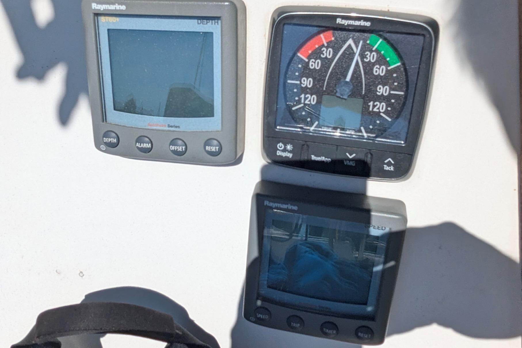 Instrumentation panel on a 1990 Catalina 42 sailboat with Raymarine displays.
