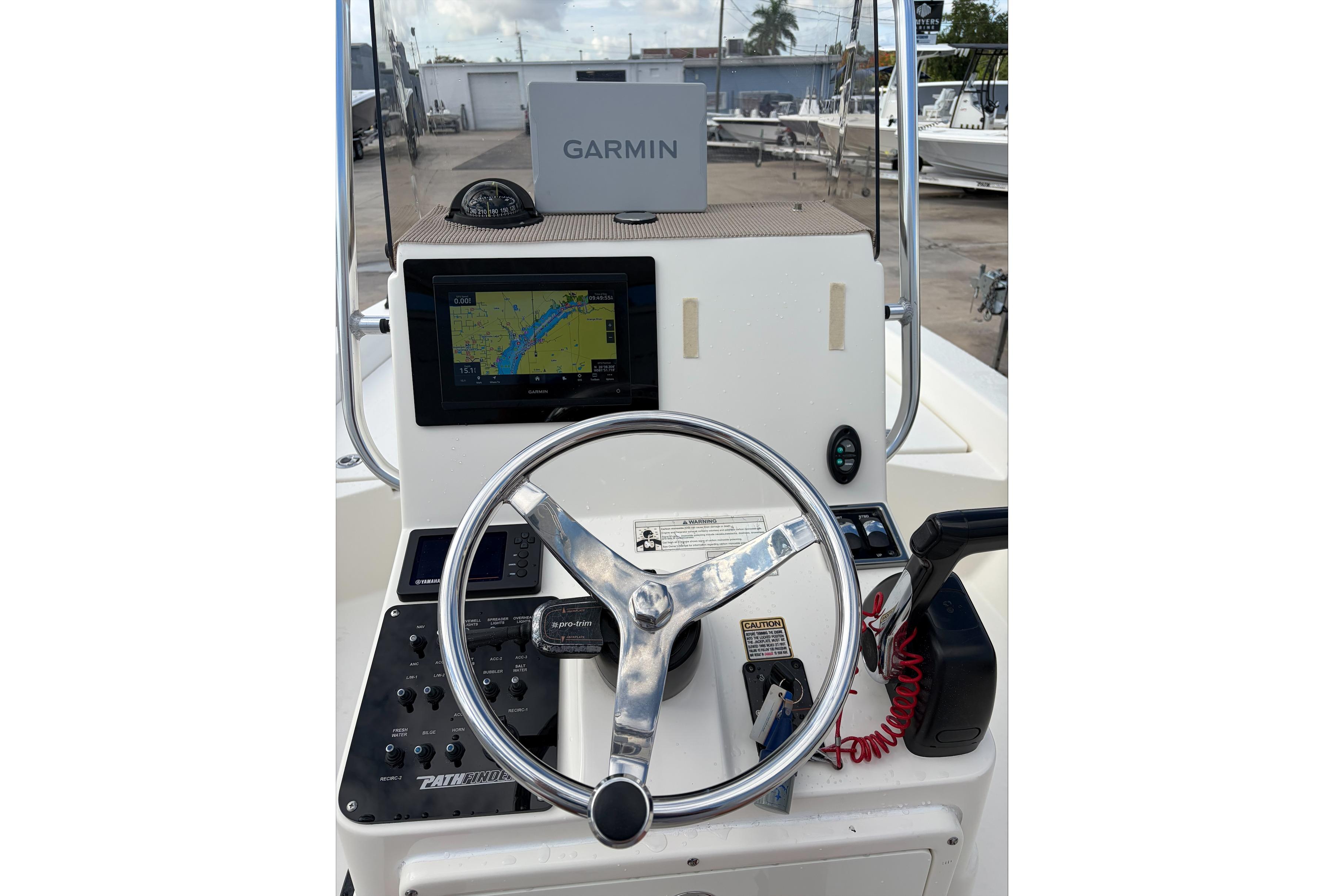 2017 Pathfinder 2200 TRS boat console with Garmin GPS and steering wheel.