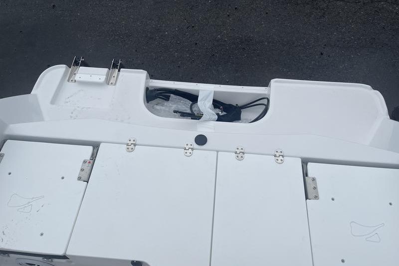 2025 Stingray 173CC boat deck with storage compartments and fittings.